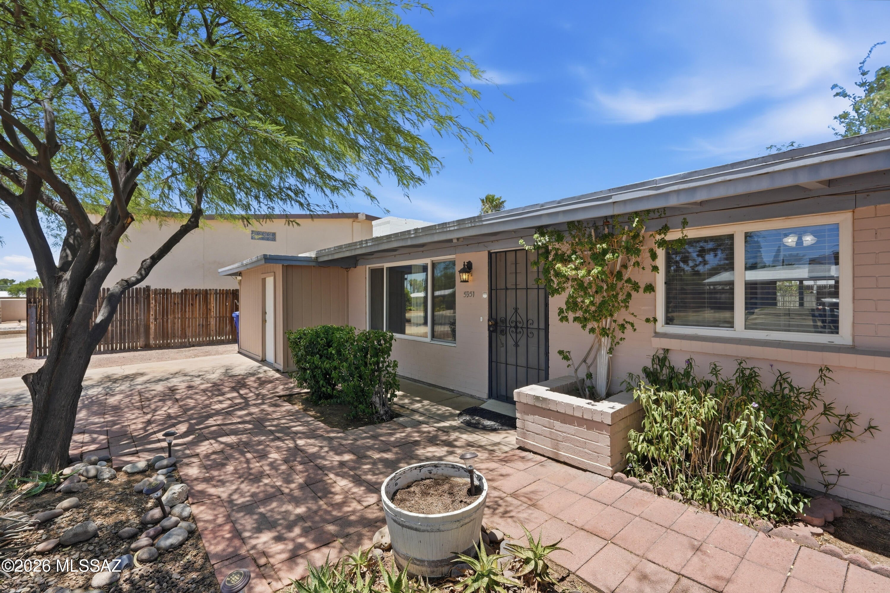 It is a rare to find a home with a long list of ADA features.  This charming 1954 home is fully wheel chair accessible.  The doorways are 36'' or greater, the kitchen counters are lower and the cooktop, oven and sink can be accessed from the sitting position, tile thru out.  The master bath includes a roll in shower and a jacuzzi tub has a motorized lift.  The primary bedroom is the size of two bedrooms.  The rear yard is fully accessible on a hard surface and a wrought iron fences separates the pool from the yard.  The home is located just south of Park Mall and supporting businesses less than a half mile away.  The home could also be used as an assisted living facility accommodating two residents and a bedroom for the caregiver.  The is NO HOA for this home on an 8,000 sq.ft. lot.