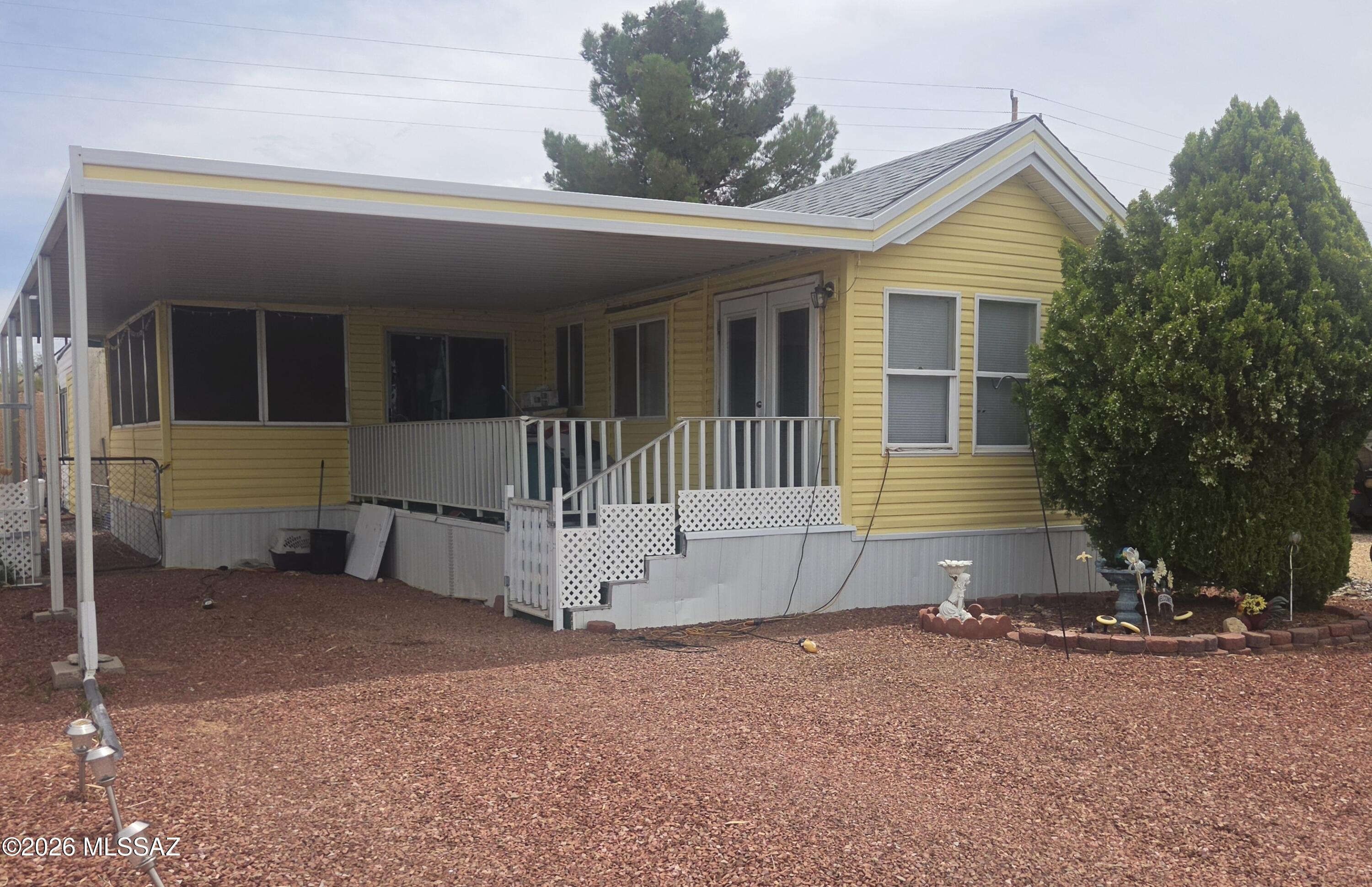 2000 Chariot Eagle park model with AZ room, covered deck and carport. The side yard has a Pergola for shade, a small fountain and patio pavers for an additional sitting area. 
This park model is located in the 55+ gated area of the Cochise Terrace Subdivision.
