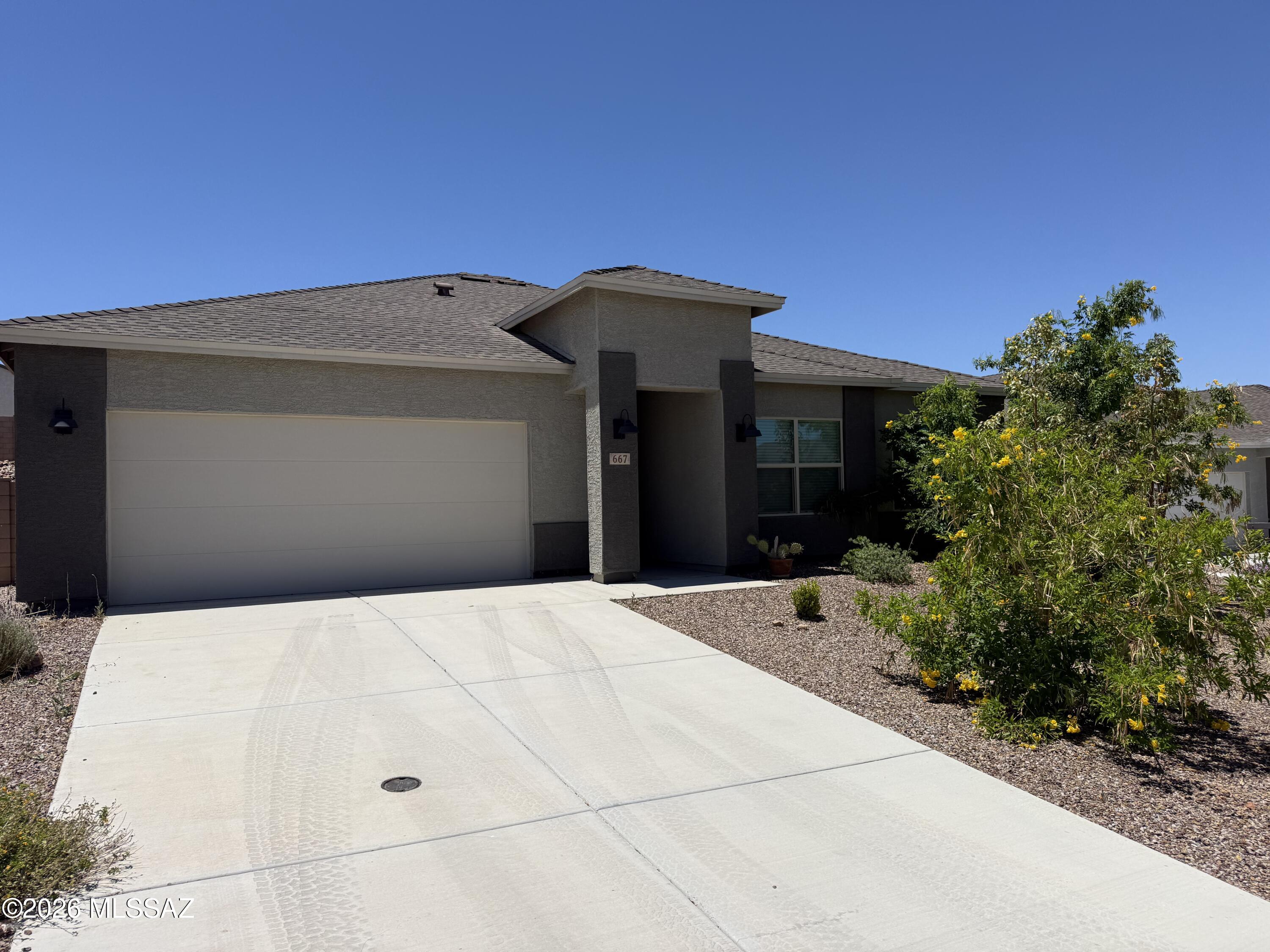 Almost new, 2023 home with 3 bedroom and 2 bathrooms. Beautifully maintained home with wood look tile, white cabinetry and quartz counter tops. Designer touches throughout home including stylish fixtures. Nicely landscaped front yard with large open backyard waiting for your personal touches. Agent/Owner