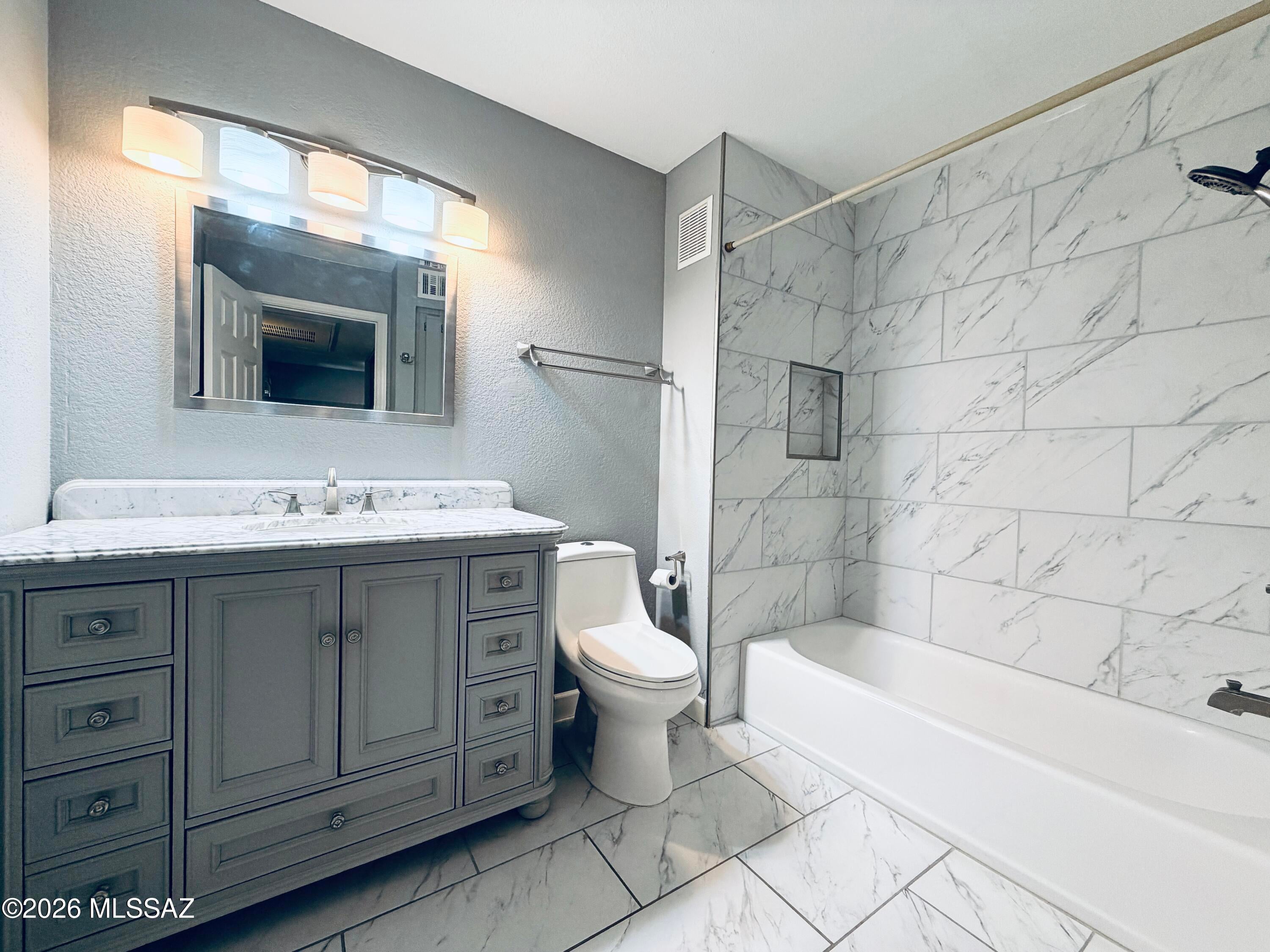 *Video Tour in Photos Section* Stunning 2BD/2BA, 1,004 sq. ft. condo in gated Villas at Sabino Canyon! Features a split-bedroom layout, updated kitchen with granite countertops, stainless steel appliances, and pantry. The primary suite offers a custom-tiled walk-in shower with modern finishes and a private balcony overlooking the pool and lush grounds. Enjoy resort-style community amenities such as the sparkling pool, spa, and fitness room. Conveniently located in the Catalina Foothills near shopping, dining, and outdoor adventures at Sabino Canyon. This home includes one assigned carport space.