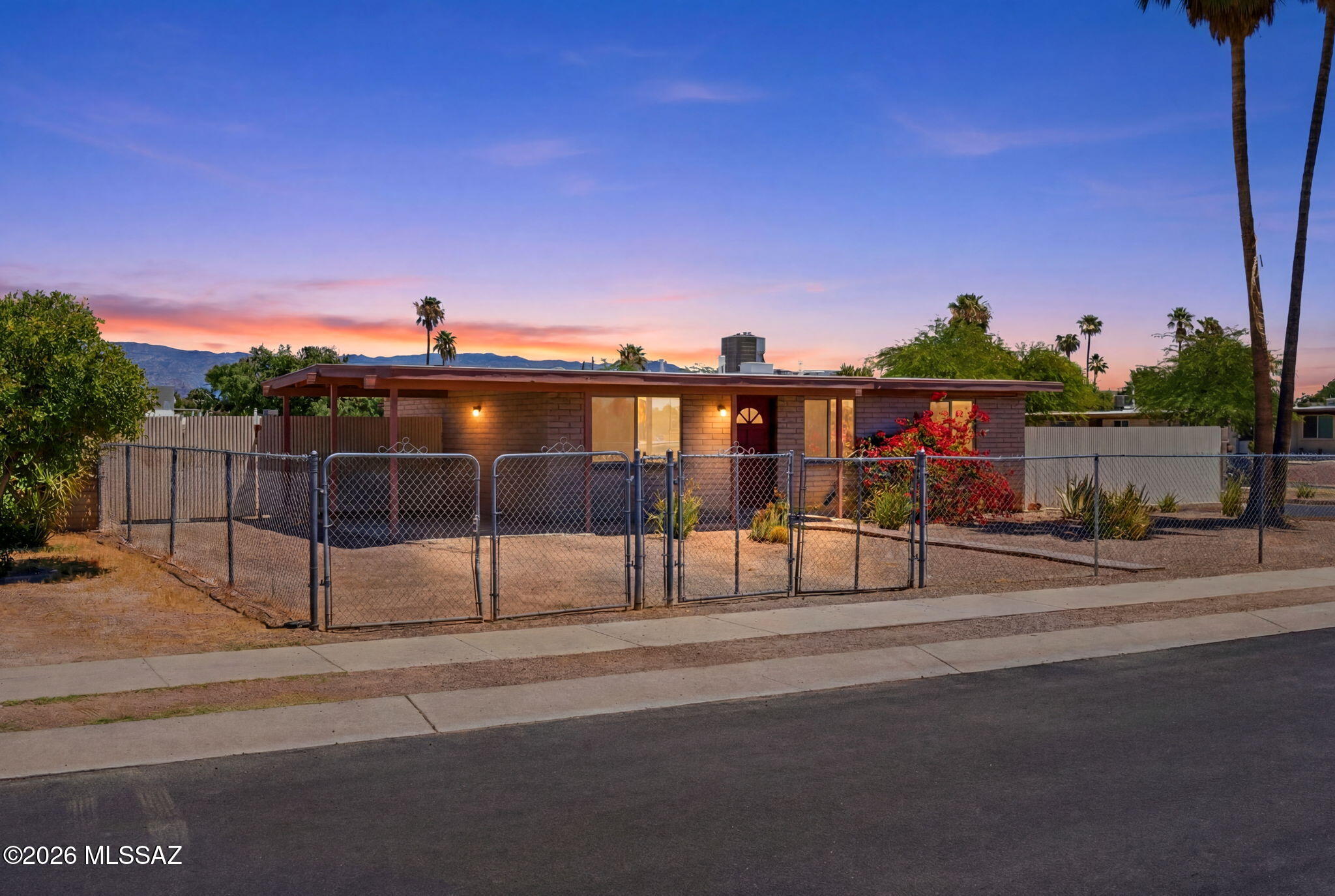 This move in ready home is located in the east Tucson offers upgraded soft-close kitchen cabinets, counter tops, sink, a bathroom with surround tile in neutral tones and ceramic tile flooring throughout the home.  A newer dishwasher and the heating and cooling system is only 5 years.  Energy efficient dual-pane windows were installed in the last few years.  There are so many possibilities for use of the spacious backyard with double gate.  Beautiful low care landscaping in front yard and No HOA.  This home won't last long.  Schedule your showing today!