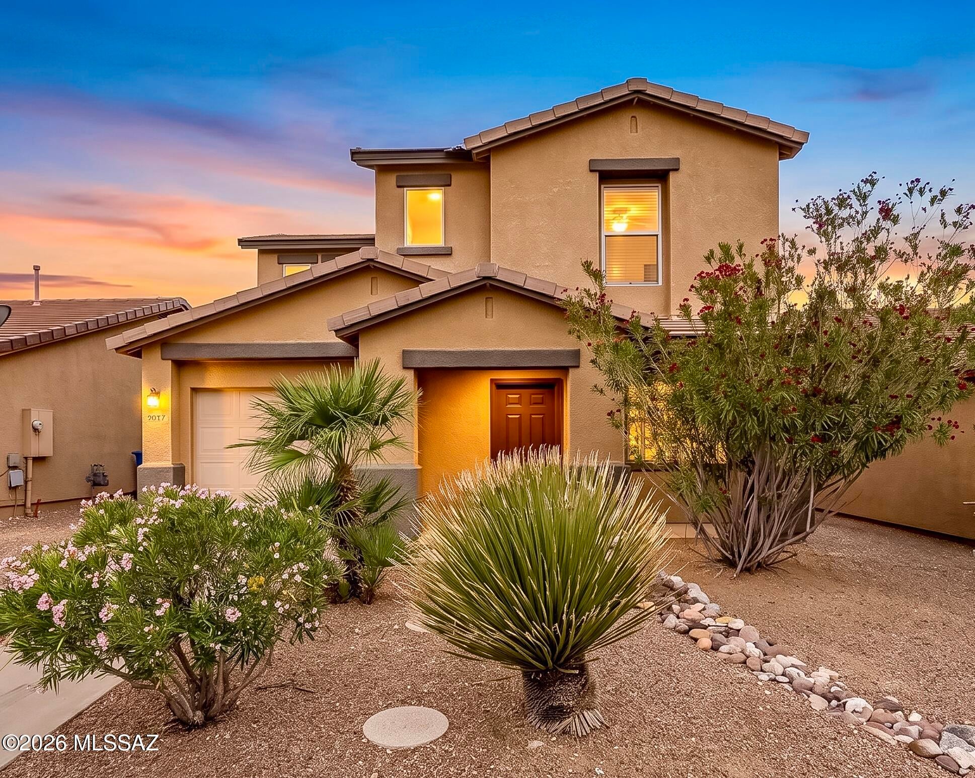 Welcome to this charming Riverhaven home, ideally tucked away on a quiet cul-de-sac in Central Tucson. Built in 2004, this two-story residence offers 3 bedrooms, 2 bathrooms, and a spacious open floor plan designed for comfortable living and effortless entertaining. The kitchen features ample cabinet and counter space, a large pantry, and stainless steel appliances replaced in 2021, creating a functional and inviting space for everyday living. Ceramic tile extends throughout the first floor, while luxury vinyl plank flooring replaced all remaining carpeting in 2022. Upstairs, the primary bedroom offers beautiful views of Finger Rock and the Catalina Mountains, along with a fully updated primary bathroom. Two additional generously sized bedrooms and another fully updated bathroom provide flexibility for family, guests, or a home office. Step outside to enjoy a backyard designed for both relaxation and connection, where a covered patio, replaced and expanded in 2021, offers a comfortable setting for outdoor dining or unwinding beneath the Arizona sky. With no neighbors directly behind and a large mature tree providing welcome shade, the spacious yard offers room for pets, family, and friends to enjoy. Numerous improvements add to the home's comfort and convenience, including a new AC system installed in 2018 and the compressor replaced in 2022, exterior repainted in 2021, interior repainted in 2026, and a water softener added in 2023. A water filtration system and reverse osmosis system in the kitchen provide added peace of mind and quality drinking water. Ideally located less than half a mile from the Rillito Bike Path and The Loop, this home offers easy access to some of Tucson's favorite biking, running, and walking routes. Nearby Brandi Fenton Memorial Park and Mehl Foothills Park, along with their dog parks, provide abundant opportunities to enjoy the outdoors. Excellent shopping and dining are close at hand, with the Tucson JCC less than 1.5 miles away, Tucson Medical Center approximately 2.5 miles away, and the University of Arizona about 3 miles from home. Blending thoughtful updates, mountain views, a peaceful setting, and convenient access to Central Tucson's amenities, this Riverhaven home offers a wonderful opportunity to enjoy the best of Tucson living.