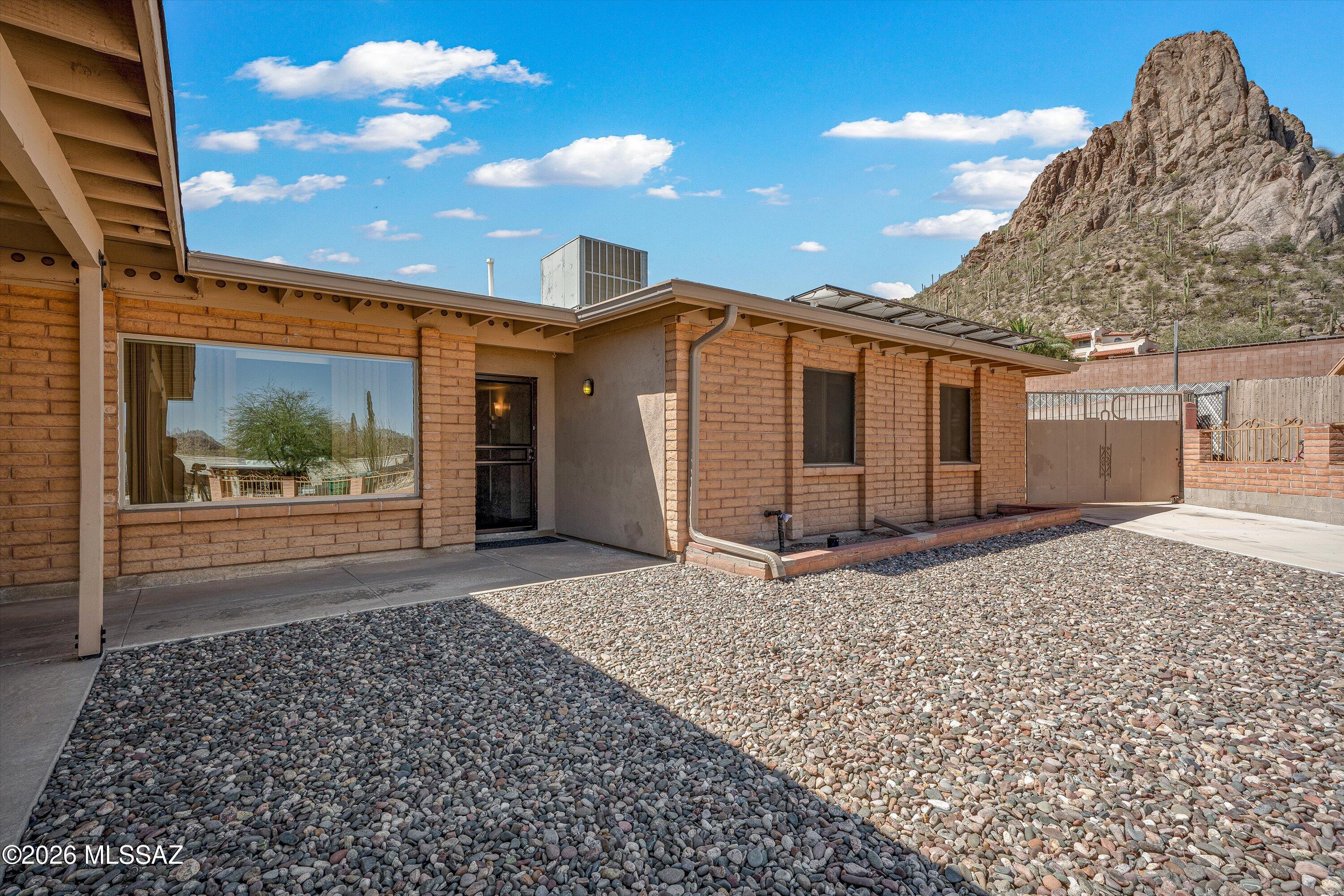 Situated in Manzanita Terrace up in the west-side foothills, shadowed by an awesome mountain peak. Light-Filled Open Living Area: Experience a bright and welcoming atmosphere with a floor plan designed to maximize natural light throughout the main living spaces. A well-proportioned kitchen that offers plenty of counter space for meal prep. Solar Lease that saves money on your electric bill along with a 530 gallon rain harvesting barrel. Quiet Cull de sac living with amenities close by.