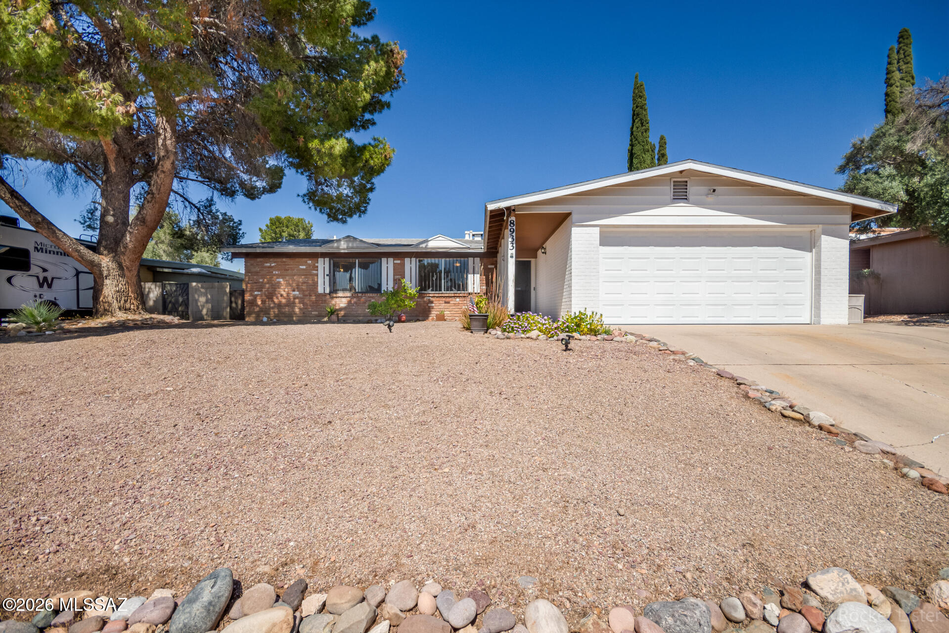 Seller's ASSUMBLE loan available at 2.3%. Stunning renovation in the coveted community of Rolling Hills! Perfectly positioned on a premium golf course lot with breathtaking Catalina Mountain views, this beautifully updated home offers 1,790 sq. ft. of thoughtfully designed living space w' 3 bedrooms PLUS den/office, 2 bathrooms, elegant tile flooring throughout & abundant natural light. Numerous recent upgrades provide both style and peace of mind, including updated flooring (2020), plumbing updates (2024), newer HVAC system (2020), newer roof (2019), kitchen update (2024), and beautifully updated bathrooms. Enter into a welcoming living room highlighted by a striking two-way fireplace that creates a warm and inviting focal point. The showcase kitchen impresses with crisp white cabinetry sleek granite countertops, stainless steel appliances, recessed lighting, and a skylight that fills the space with natural brightness. The spacious primary suite features a stylish designer barn door entry and an updated en suite bathroom with a distinctive herringbone pattern countertop and vessel sink. Step outside to enjoy sweeping golf course and Catalina Mountain views from the relaxing covered patio, complemented by low-maintenance artificial turf. Ideally located near schools, shopping, dining, recreation areas, and medical facilities, this exceptional home truly has it all. A must see!