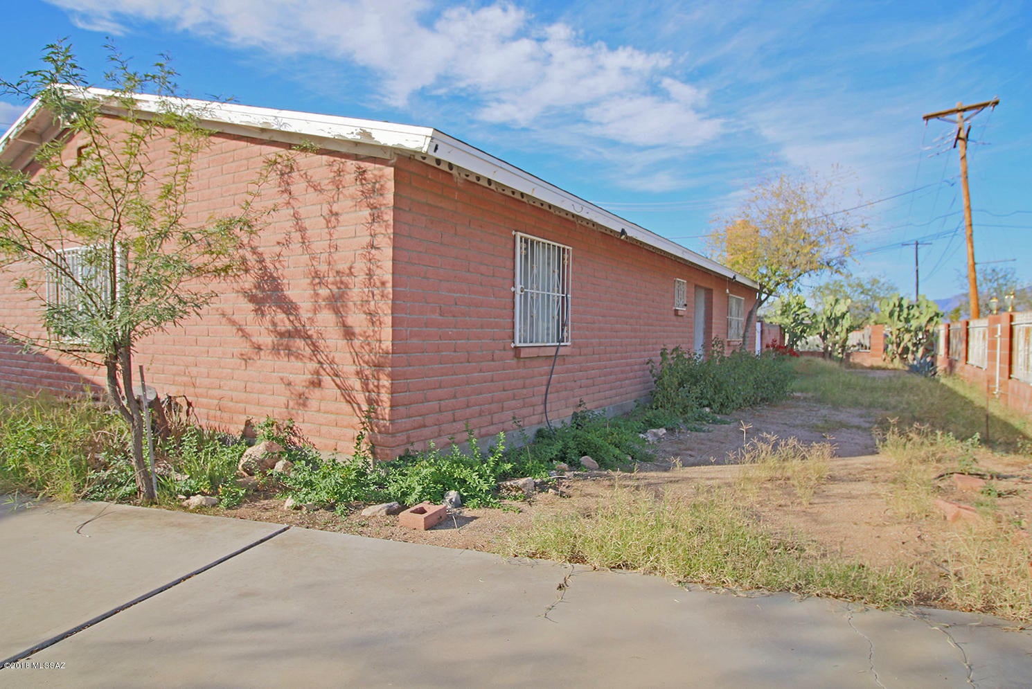 Huge lot, two homes, and endless possibilities! Create your own midtown compound with room for your toys, RV, and future improvements. Featuring entrances from Palo Verde and Holt, an oversized garage/workshop, and abundant storage, this property offers flexibility to live in one home and rent the other or bring your vision to a spacious two-home retreat. Explore the potential to expand or investigate a possible lot split, subject to zoning requirements and City approval. Bring your creativity and make this unique opportunity your own!