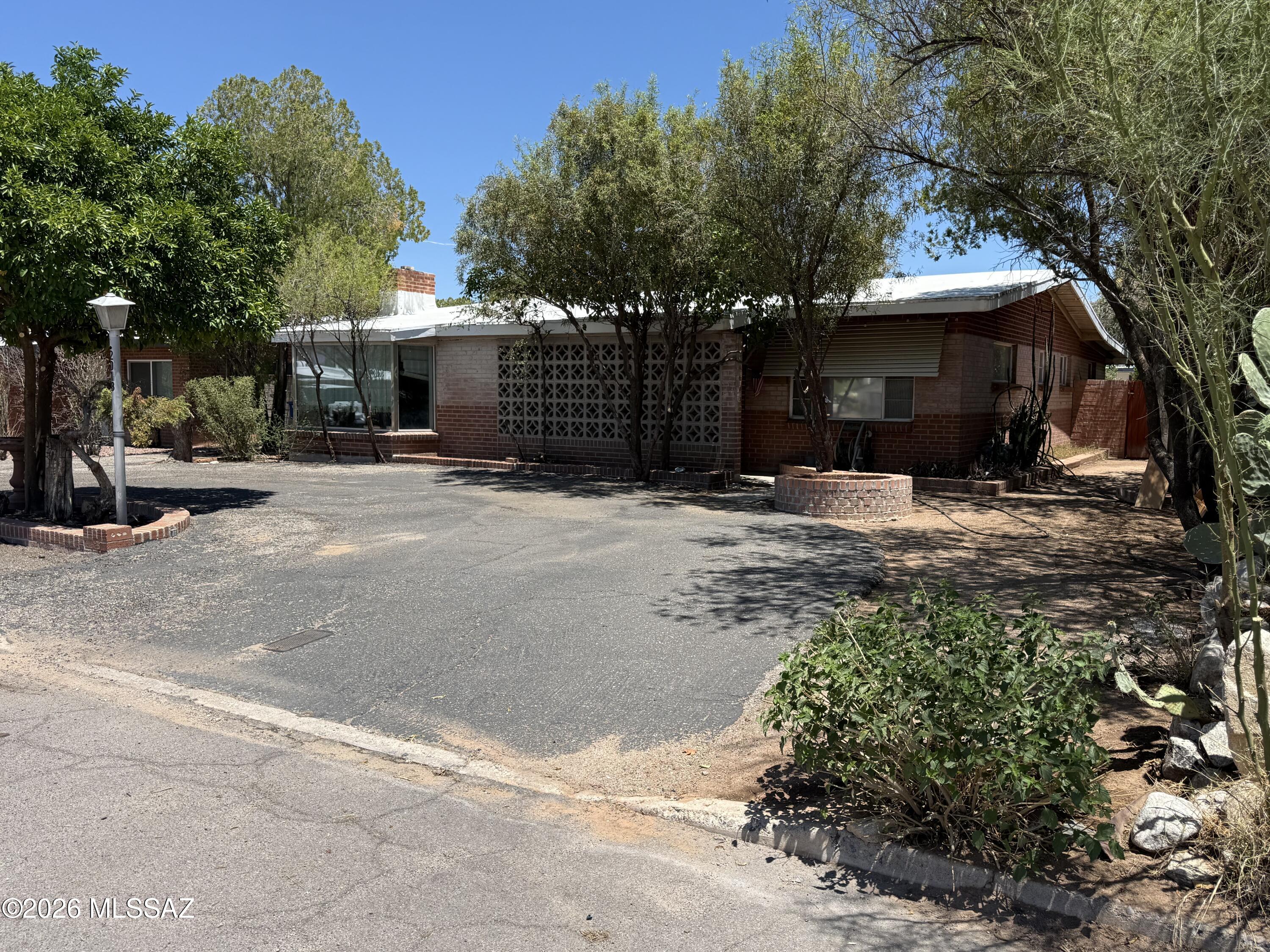 Attention Cash Buyers, Real Estate Investors, Fix-and-Flip Specialists, and Short-Term Rental Operators!

Rare opportunity to acquire a substantial property in one of Tucson's most desirable investment corridors, located just 12 minutes from the University of Arizona. Properties with this combination of size, location, lot dimensions, and value-add potential and are becoming increasingly difficult to find.

This solid brick home sits on an oversized lot and offers the ideal foundation for a profitable renovation project, long-term rental investment, student housing opportunity, or potential short-term rental. With strong demand driven by the University of Arizona, major employers, healthcare facilities, and Tucson's growing population, investors will appreciate the multiple exit strategies this property provides.

Inside, you'll find a spacious and functional floor plan with generous room sizes and excellent bones. The home's solid brick construction offers durability and long-term value, while the layout presents numerous opportunities for modernization and increased equity. Whether you're looking to complete a cosmetic update or a more comprehensive renovation, this property has the framework to become a standout asset in your portfolio.

The backyard is a true highlight, featuring a sparkling swimming pool, mature shade trees, and established desert landscaping. The oversized lot provides ample space for outdoor entertaining areas, additional amenities, storage solutions, or future enhancements that can significantly boost rental income and resale value.

You don't want to miss this opportunity!