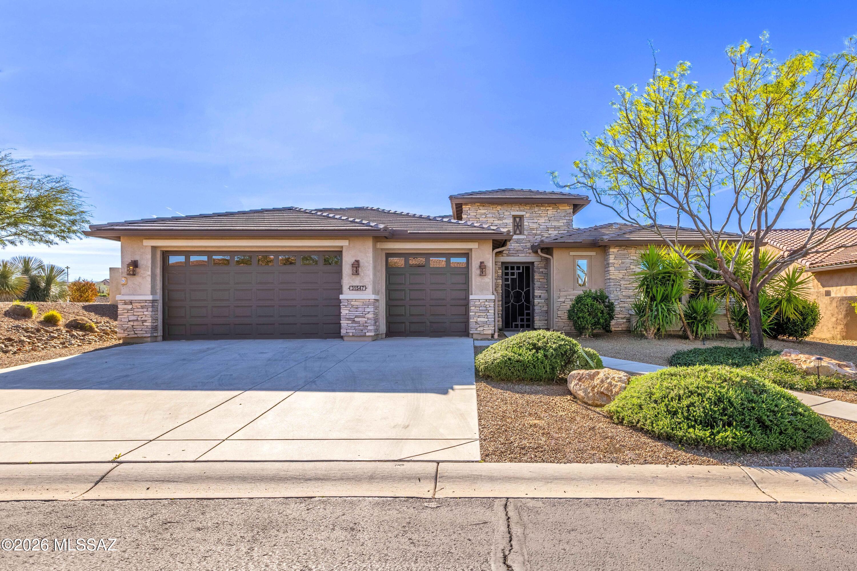 An upgraded and expanded Tesoro Exterior Design D - Premiere Series at SaddleBrooke Ranch in the very desirable unit 46A! This home includes a Custom Tile Entry Way; 2-Bedroom En Suites; Powder Room, Great Room w/Media Alcove; Dining Room; Grand Kitchen Island with adjoining Butler's Pantry and Walk-In Pantry; Dining Room; Spacious Office/Den that can double as an extra bedroom; Owner's Entry Valet with Cabinets; Walk-In Coat Closet; Walk Up Dry Bar w/wine refrigerator; Large Laundry Room w/craft and folding station; Deep 2-Car and Golf Cart Garage w/Extra Storage; Covered Outdoor Living Space that has been incorporated (with permits) into a Game Room that  adds 410 Sq. Ft. to the interior space making the home approximately 2,971 Sq. Ft.; 9' and 11' foot ceilings through-out the home. The Master Bedroom En Suite has 2-Walk-In Closets; Dual Vanities; 42" by 60" Soaking Tub; and 42" X 60" Walk-In Shower with Seat. The 2nd Bedroom En Suite has a Walk-In Closet; and Shower/Tub Combo. The view from both the Great Room, Game Room, and Dining Room into the backyard is truly what defines this home. Washer/Dryer and refrigerator convey with the home. The expansive backyard has an exceptionally large back patio, expansive water fountain, BBQ area, and is fully fenced. Whether you relax out in the exquisitely designed entertainer's backyard or Game Room - you will realize this is a true entertainer's home.