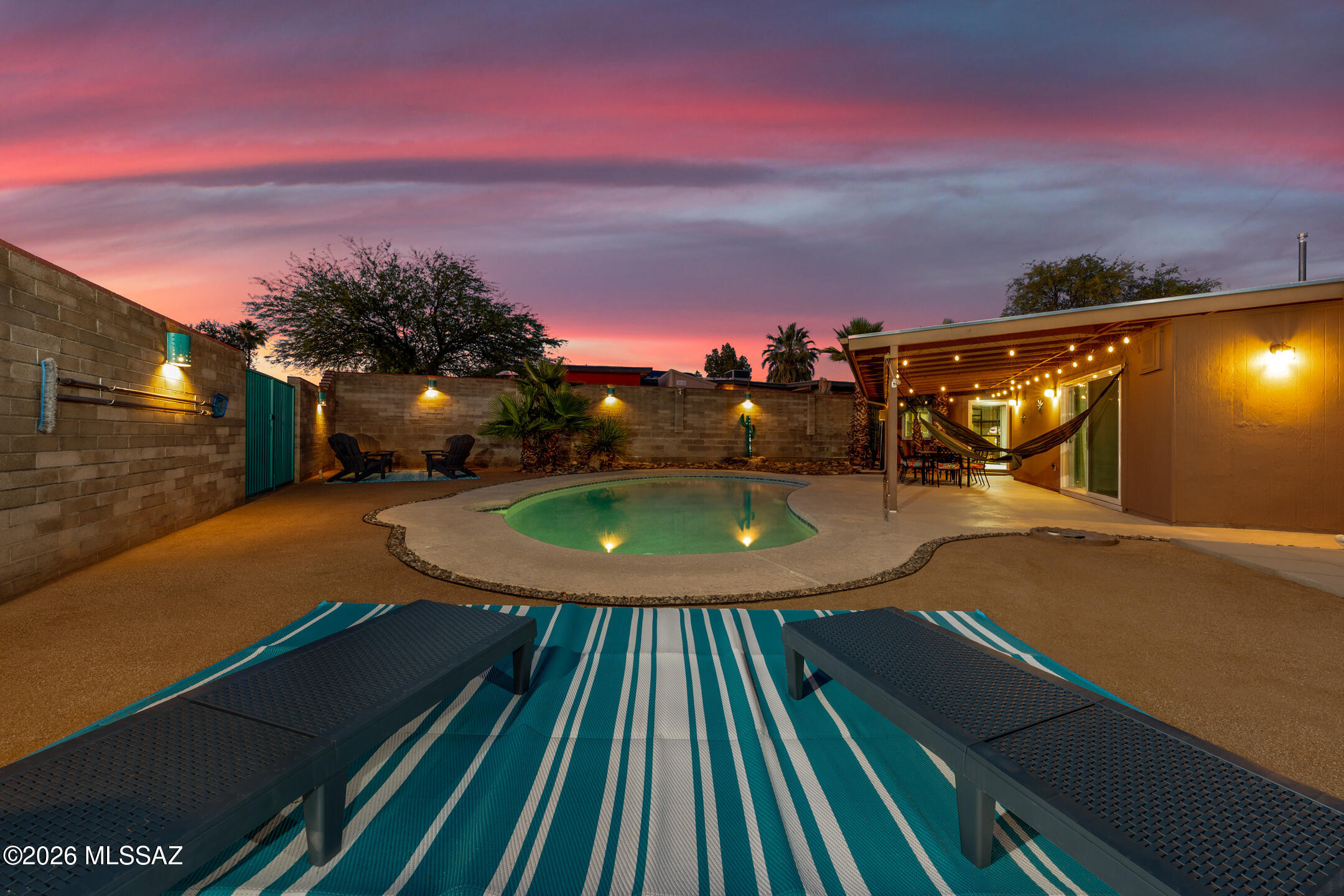 This thoughtfully improved home showcases years of intentional enhancements inside and out. From the moment you arrive, you'll appreciate the fresh exterior paint, low-maintenance desert landscaping, and added privacy of the block wall fencing.

Step inside to discover a fully updated interior featuring brand-new LVP flooring throughout, fresh interior paint, and upgraded lighting and ceiling fans that create a modern, cohesive feel. The versatile floor plan now includes a converted 4th bedroom, offering flexibility for guests, a home office, or additional living space. Double-pane vinyl windows and custom metal security screens provide both energy efficiency and peace of mind. At the heart of the home, the kitchen is ready for everyday living and entertaining with stainless steel appliances, ample counter space, and a breakfast bar. The adjoining family room features a cozy wood-burning fireplace--perfect for relaxing evenings.

Major system upgrades bring long-term value, including a newer HVAC system with natural gas and central refrigeration (2023), a roof refinish, and a Springwell salt-free water system. A detached casita with its own AC adds even more versatility--ideal for guests, a studio, or a private workspace.

Step outside to your backyard retreat, complete with a sparkling pool, new pool pump, covered patio with roll-down shades, and space to gather, relax, or entertain. Additional features like a hot-water faucet at the carport add convenience.

This home combines comfort, functionality, and meaningful upgrades. Your next chapter starts here!