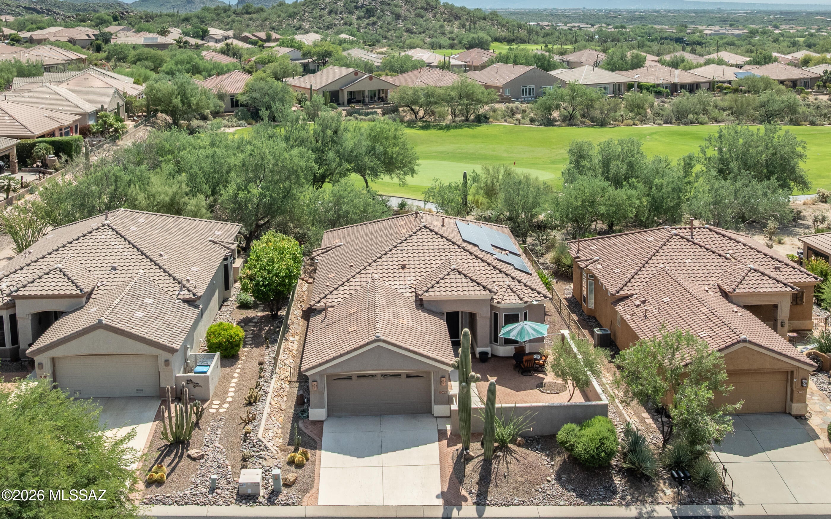 YOU ARE GONNA LOVE THIS HOME. Highly UPGRADED EXTENDED HILLSBORO ON THE GOLF COURSE. Off the 3rd Green with EAST FACING VIEWS - Golf Course, Desert and Mountains. Newer Roof,  OWNED SOLAR PANELS, HVAC, Water Heater, Front Gated Courtyard. Step into the inviting Open Floor Plan. Entertainer's Kitchen w/Granite Counter Tops, Pendant Lighting, Wood Cabinetry, Large Pantry and SS Appliances. Extended DEN w/Built-In Desk & Shelving, Fabulous Owner's Suite w/Room for Any Size Bed, Large Walk-In Closet, Upgraded BATH. Guest Bedroom & Upgraded BATH. Family Room w/Gas Fireplace & Media Inserts. Extended Laundry Room w/Utility Sink. 1822 Sq Ft; 2BR/2BA + Extended DEN w/2 Car Garage. Dining Area off Kitchen. Large Covered Patio w/Grilling Station & VIEWS. Call today for a personal showing. Seller Owned Solar Panels.  Lower utility bills for sure.  Come see this one soon.