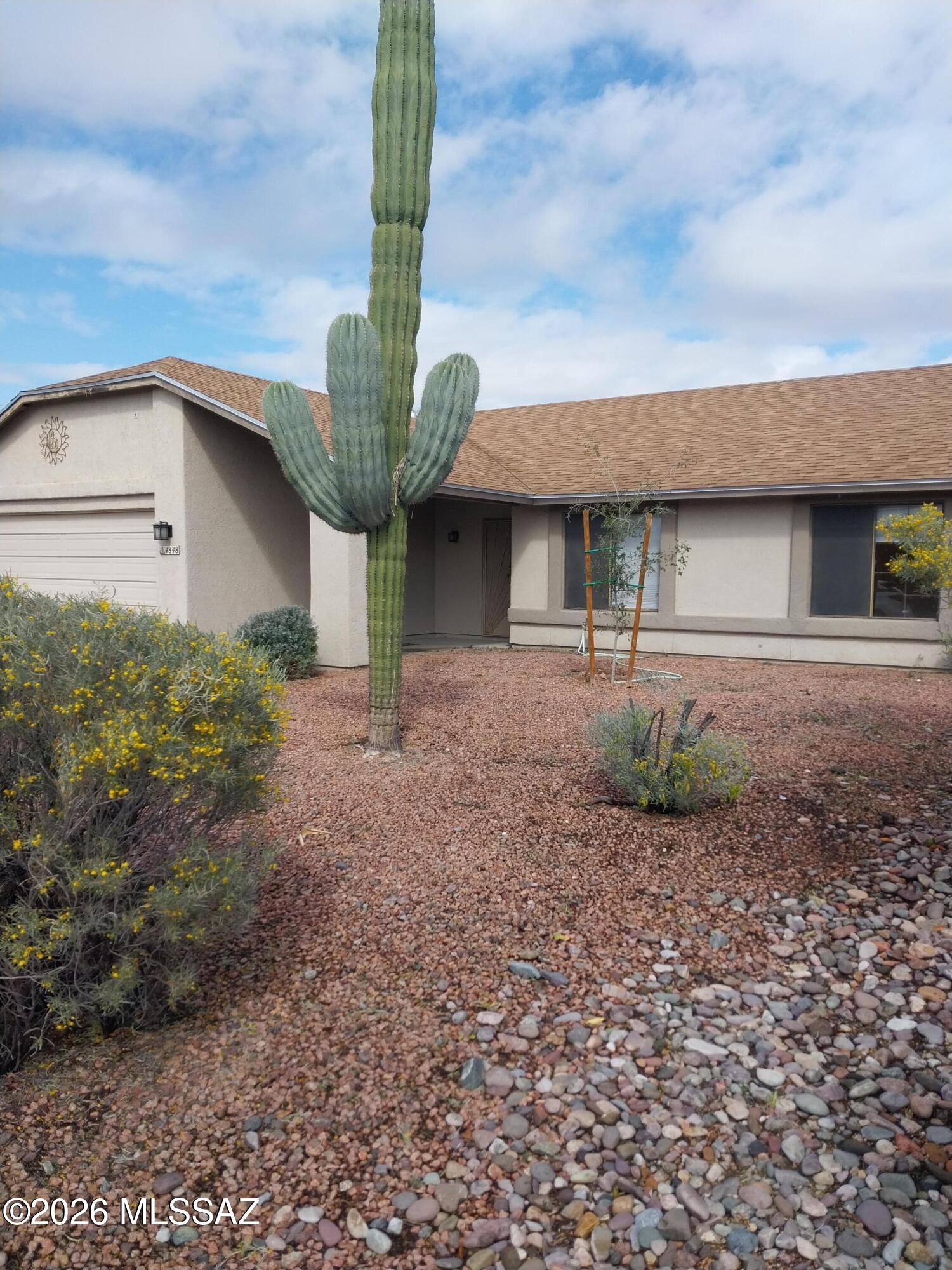 HOA Not Mandatory, Great Lot Backs To Open Desert! 3Bedroom, One Full Bathroom, & One Three Quarter, Beautiful Flooring,  Great Fireplace never used by Owner, Newer Roof, HVAC System And Hot Water Heater. 
 Approximately 1 Mile To 1-10 For Quick Commuting. 
Convenient To Shopping , Restaurants And Golf Courses!