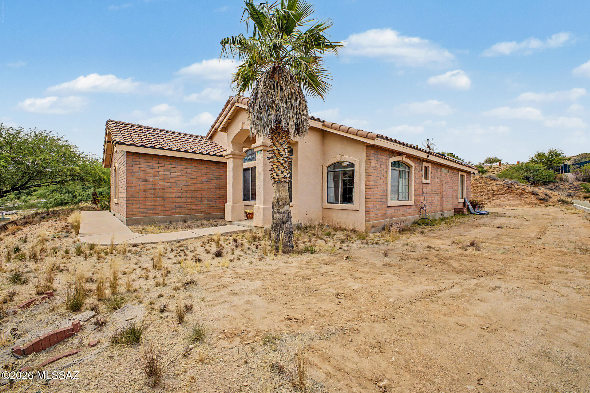 The seller is willing to give 3,000 credit towards closing costs or 3,000 credit towards flooring. Seize the chance to own this charming 3-bedroom, 2-bath residence now available on the market! Inside, you'll find an inviting living room with vaulted ceilings, a soothing palette, abundant natural light, and a harmonious blend of soft carpeting and tile flooring. The well-appointed kitchen comes with flat-panel cabinets, skylights, recessed lighting, stainless steel appliances, and a two-tier peninsula with a breakfast bar. The cozy primary bedroom includes direct backyard access for seamless indoor-outdoor living, a private bathroom, and a walk-in closet. Unwind on the covered patio, perfect for al fresco dining or refreshing drinks. The backyard offers a blank canvas for crafting your own private oasis. Don't miss out on this one!