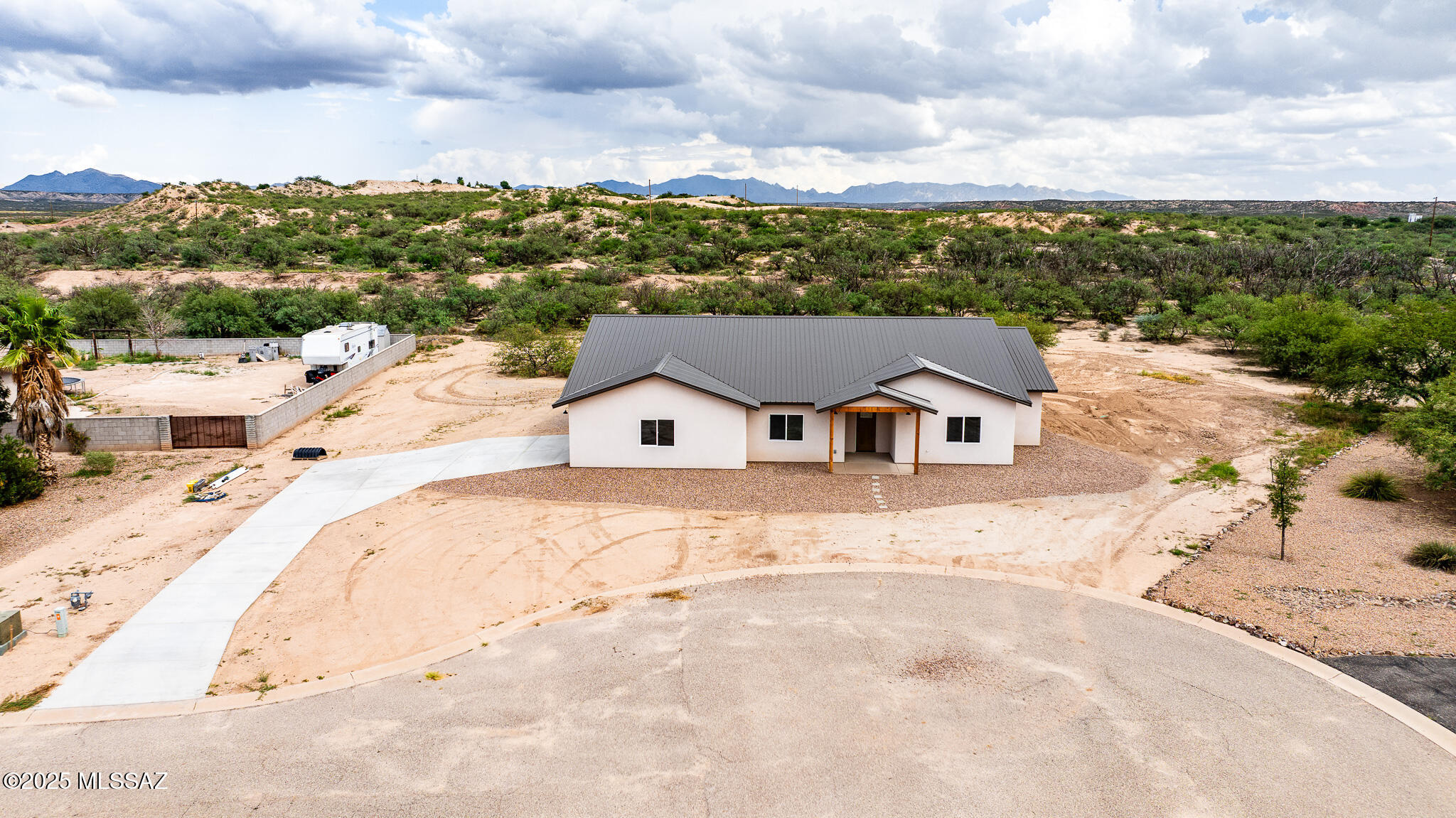 MOTIVATED SELLER!  BRING ALL OFFERS! Welcome to this stunning new construction home, offering 2470sqft of thoughtfully designed living space on a spacious 1ac lot with paved road access. This 4 bedroom, 2.5 bathroom residence features modern elegance with polished concrete floors, granite countertops, and an open-concept layout perfect for comfortable living and entertaining. The kitchen boasts sleek granite surfaces, ample cabinetry and a functional flow into the dining and living areas. The primary suite is a luxurious retreat with a walk-in shower, soaking tub and generous closet. Additional bedrooms provide ample space, while a versatile den can be used as a home office or bonus room.This home is a rare opportunity to own a brand-new, move in ready property!