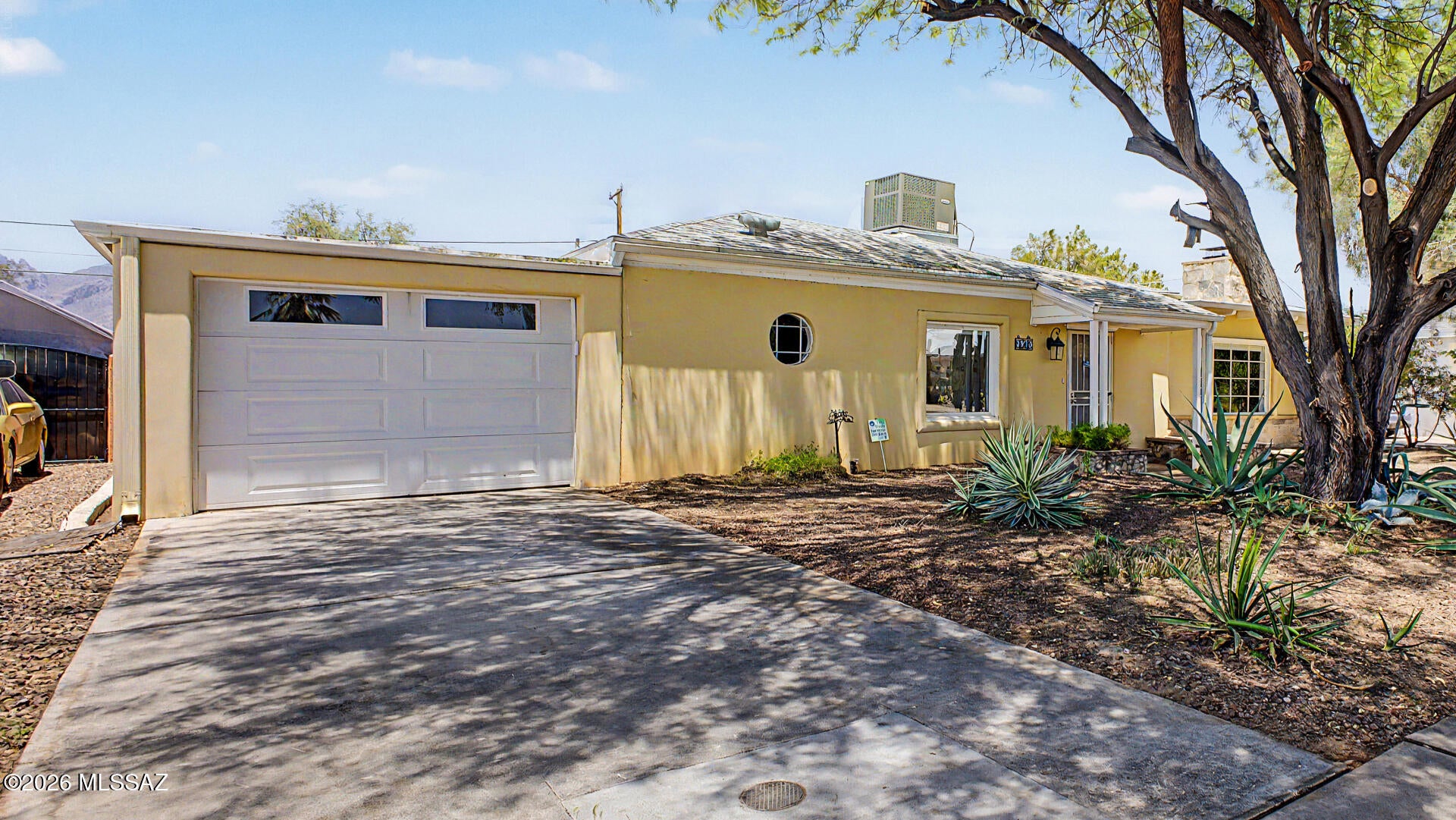 MOTIVATED Sellers!!! Discover this beautiful Garden District property featuring a 2-bedroom, 2-bath main home with bamboo flooring and a den/office adjoining each bedroom. A separate 1-bedroom, 1-bath guest casita includes its own full-sized living room and kitchen, making it ideal for guests, multigenerational living, or rental income. Relax in the stunning backyard, transformed into a desert oasis with an automatic irrigation system and rainwater harvesting tanks. Conveniently located less than 15 minutes from the U of A, downtown, and 4th Avenue, with shopping, gyms, and the Tucson Botanical Gardens just minutes away. Welcome home!