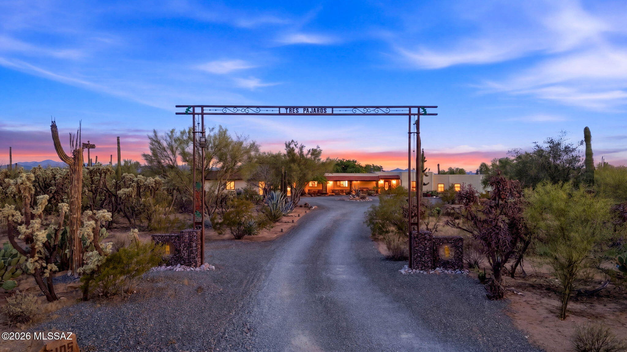 Nestled on over 4 acres of lush Sonoran Desert with stunning mountain views, this beautifully maintained hacienda-style estate offers the perfect blend of luxury and functionality for ranch or horse property living. Built with superior ICF construction, the home features a flexible 4-bedroom or 3-bedroom plus office layout, 3 full baths plus a powder room, including a private en-suite guest room. Custom upgrades throughout include Pella windows, solid wood doors, stained concrete floors, hand-painted tile, dual copper kitchen sinks, pot filler, gas cooktop, and stainless steel appliances. Outdoor amenities shine with a heated custom pool, private pickleball court, labyrinth outdoor kitchen/BBQ, covered patios, professional landscaping, exterior lighting, RV hookups with parking pad, & more