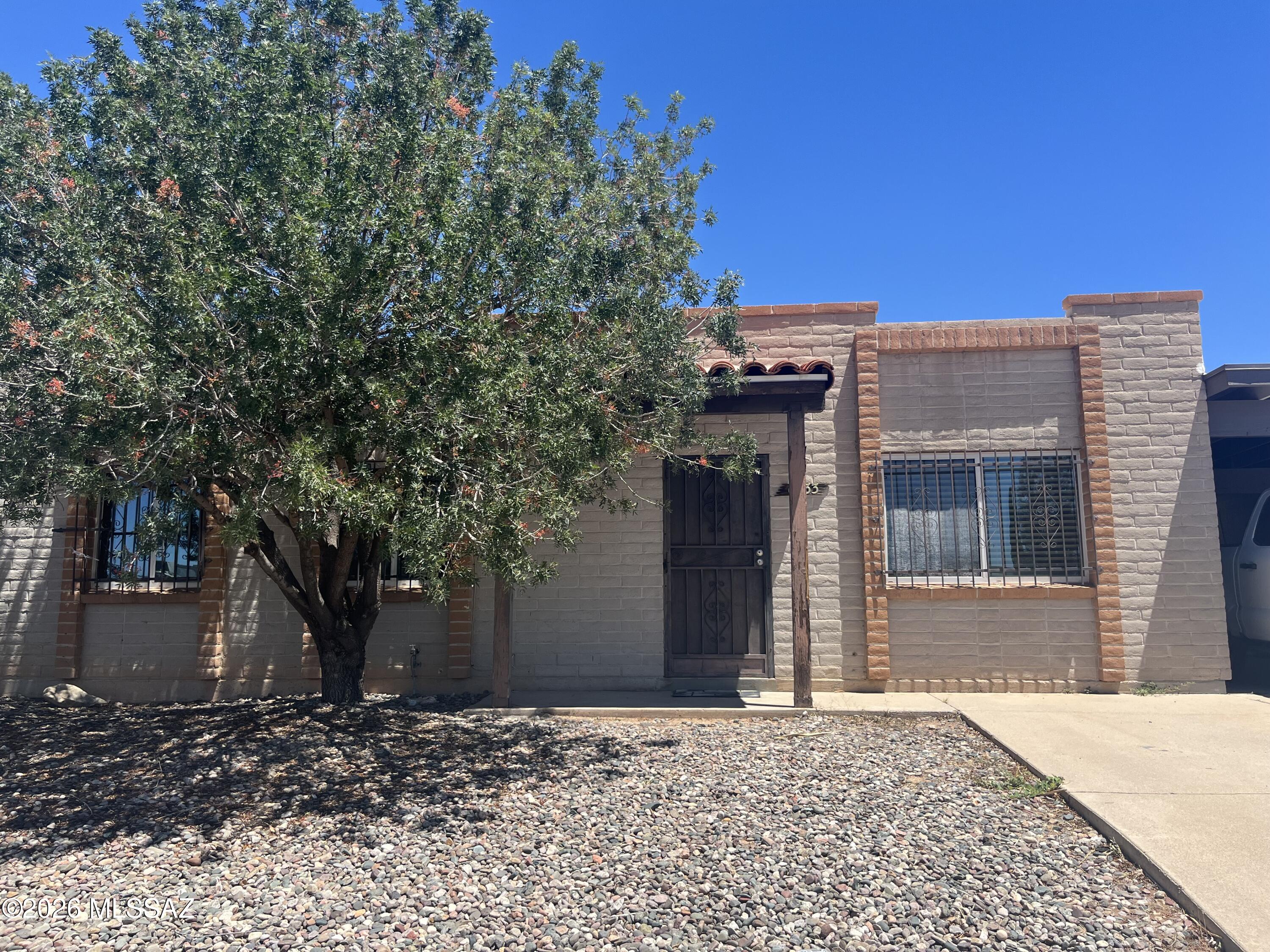 3-bedroom, 2-bath slump block townhome, laundry room/workshop with one carport. All-new paint, ceramic tile floors, and carpet in 2 bedrooms.Quiet neighborhood with low-maintenance yard. Managed by Chas Hughes of Chasandcompany