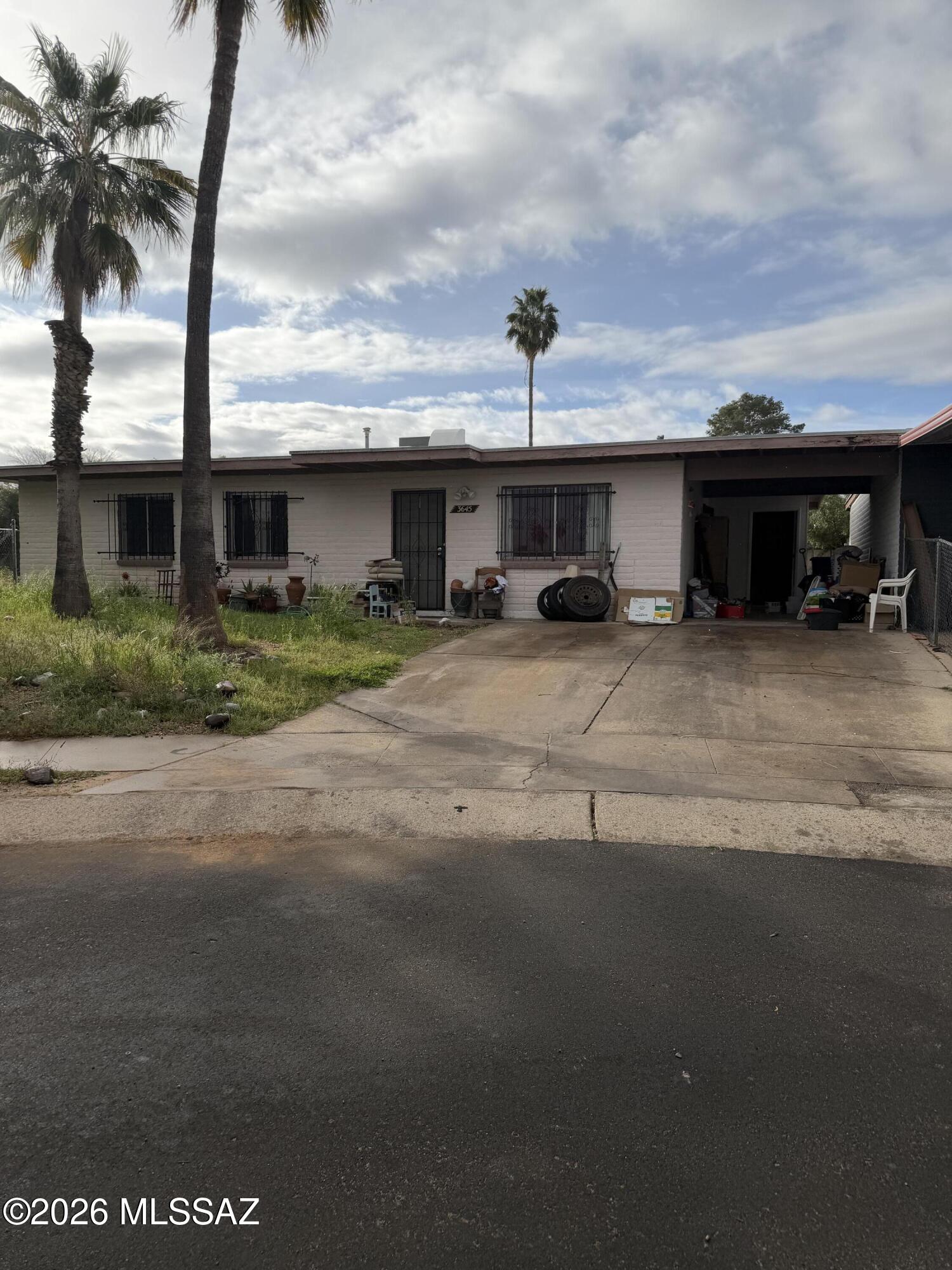 Opportunity awaits with this 3 bedroom townhouse. Some minor TLC and this secluded townhome is move in ready. Open kitchen, laundry room, two bathrooms. Centrally located to restaurants, shopping and the airport. One covered carport spot.  Please refer to the Agent Only remarks for more information about this sale!