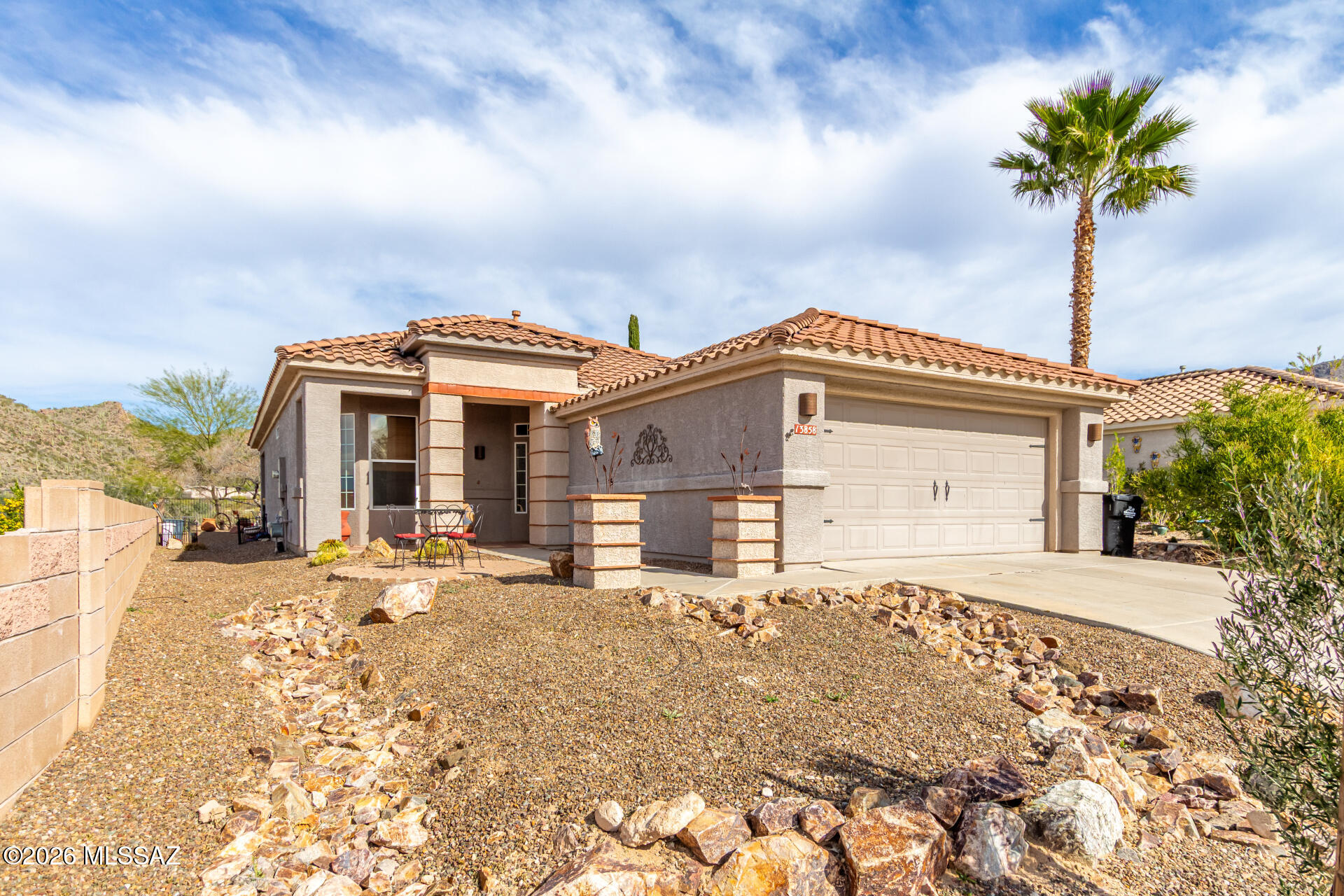 This is NOT your typical Highlands home-that's what makes it extraordinary! If you appreciate character, craftsmanship, and one-of-a-kind style, this eclectic gem will steal your heart. Extended Aurora Model with stunning tongue and groove ceiling in the kitchen/den with dramatic exposed wood beams in other living spaces, warm Southwestern palette with bold pops of color and custom architectural details. Bay windows flood the home with natural light, 2 beautifully remodeled bathrooms with designer finishes, large functional laundry room with plenty of storage.  Built-in bar area is perfect for entertaining.  Spacious backyard with panoramic mountain views of multiple peaks,  Covered patio and outdoor entertaining spaces to enjoy Arizona sunsets. This home is made for gathering! Whether you're hosting dinner parties, enjoying morning coffee with mountain vistas, or creating your own creative sanctuary, this property offers a lifestyle of comfort and character you won't find anywhere else in The Highlands.