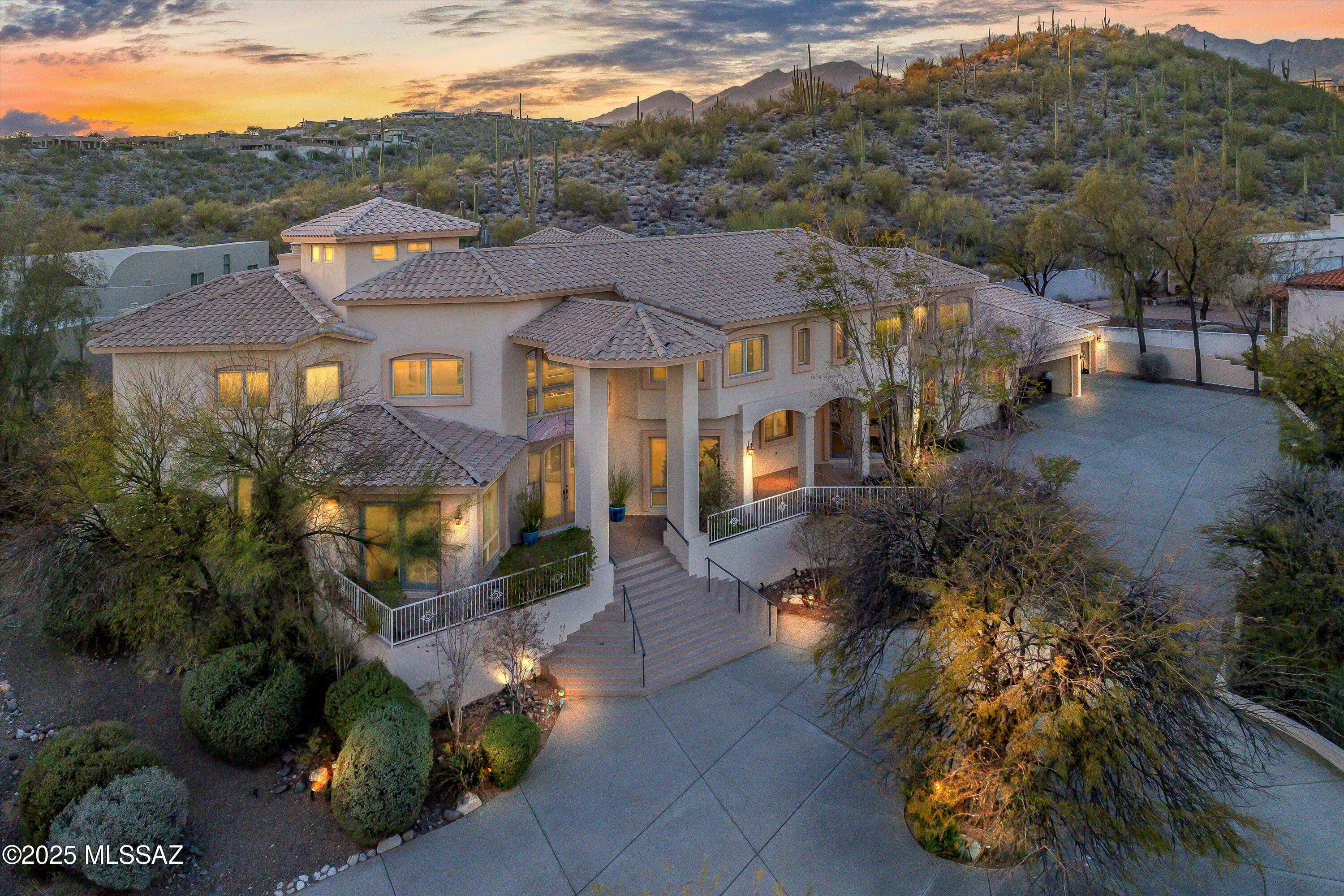 Luxury Live Auction! Bidding to start from $1,740,000.00!

On top of the hill, in prestigious Sabino Vista Hills community, this breathtaking Mediterranean-style estate, designed by renowned architect John Campisano, offers an unparalleled blend of elegance, comfort and views. Built with masonry stucco construction and custom large windows, this residence spans 7,492 square feet hosting a remodeled six bedrooms, 5 full bathrooms and a powder room, on a beautifully landscaped 0.97-acre lot. Upon entry, guests are greeted by a grand foyer with soaring ceilings and looking out to the backyard oasis. Stained concrete, wood and tile flooring throughout leading into a formal living room with one of three fireplaces with mountain and city views. Owner/Agent