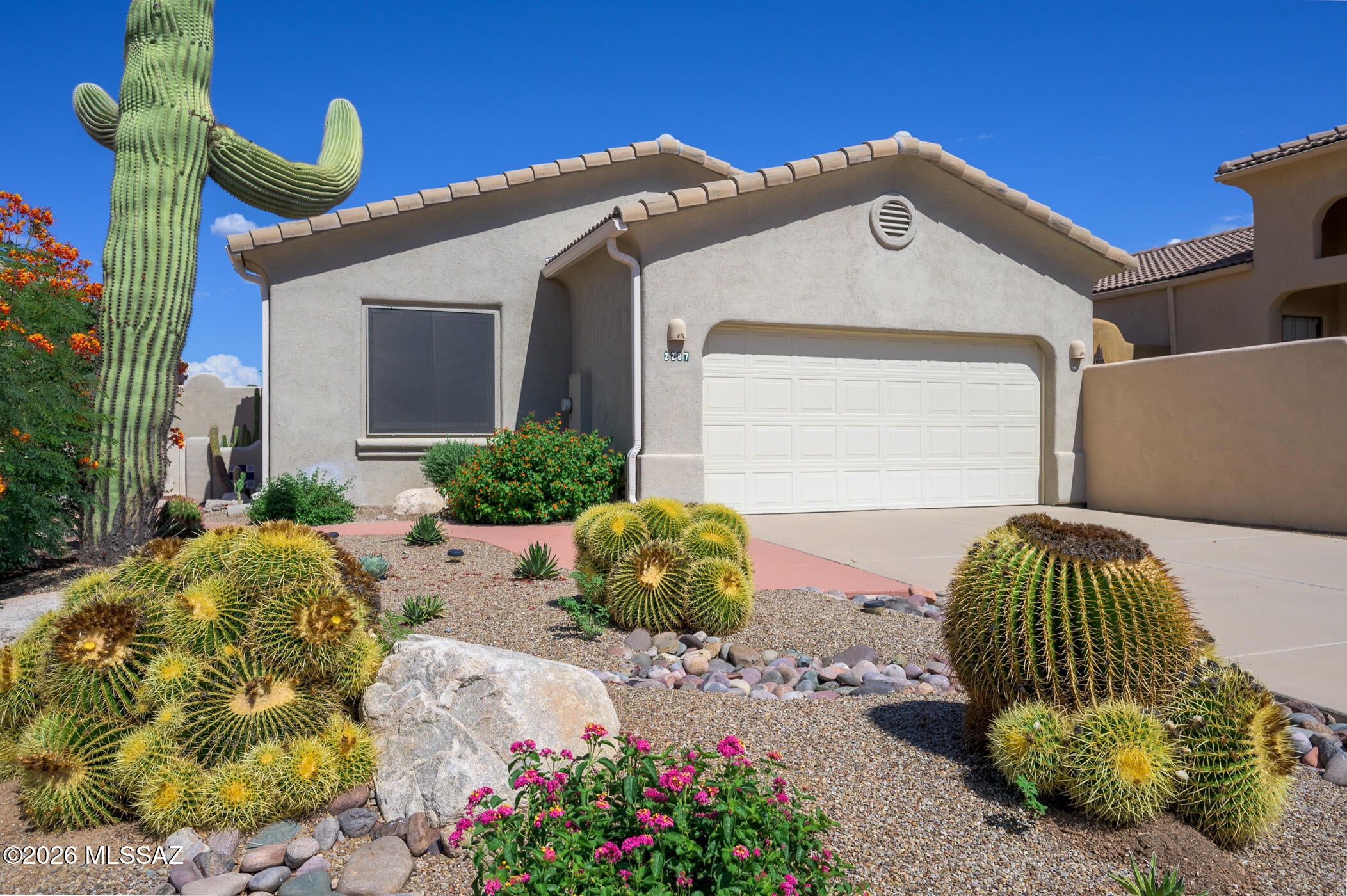 Welcome to the vibrant 55+ lifestyle you've been searching for! This meticulously updated home offers comfort, style, and the active retirement experience you desire, all nestled within a Forbes magazine-rated Top 10 Community for retirees.  From the moment you arrive, you'll be charmed by the inviting curb appeal, highlighted by desert barrel cacti and a fabulous saguaro cactus. Upon entering, you will discover attractive tile flooring that seamlessly traverses the main living areas, setting the stage for easy maintenance and timeless elegance.  The heart of the home is a spacious great room with an eye-catching pot ledge, perfect for showcasing your favorite artwork or decorative accents. The open layout effortlessly integrates to a modern kitchen, complete with classy white cabinetry and gorgeous granite countertops--ideal for both everyday living and entertaining.  Enjoy two well-appointed bedroom suites, each offering privacy and comfort. The primary suite includes an extended area filled with natural light and mountain views--making it suitable for use as a home office or a cozy sitting room.  Unwind in your screened patio, a peaceful retreat for enjoying Arizona's splendid weather throughout the year.  The backyard features easy-care desert landscaping, giving you more time to enjoy the community's amenities, including social clubs, swimming pools, and walking trails. With thoughtful updates throughout, this move-in ready home is your gateway to an active, carefree lifestyle. Experience the ideal combination of relaxation and recreation within this exceptional retirement community.
