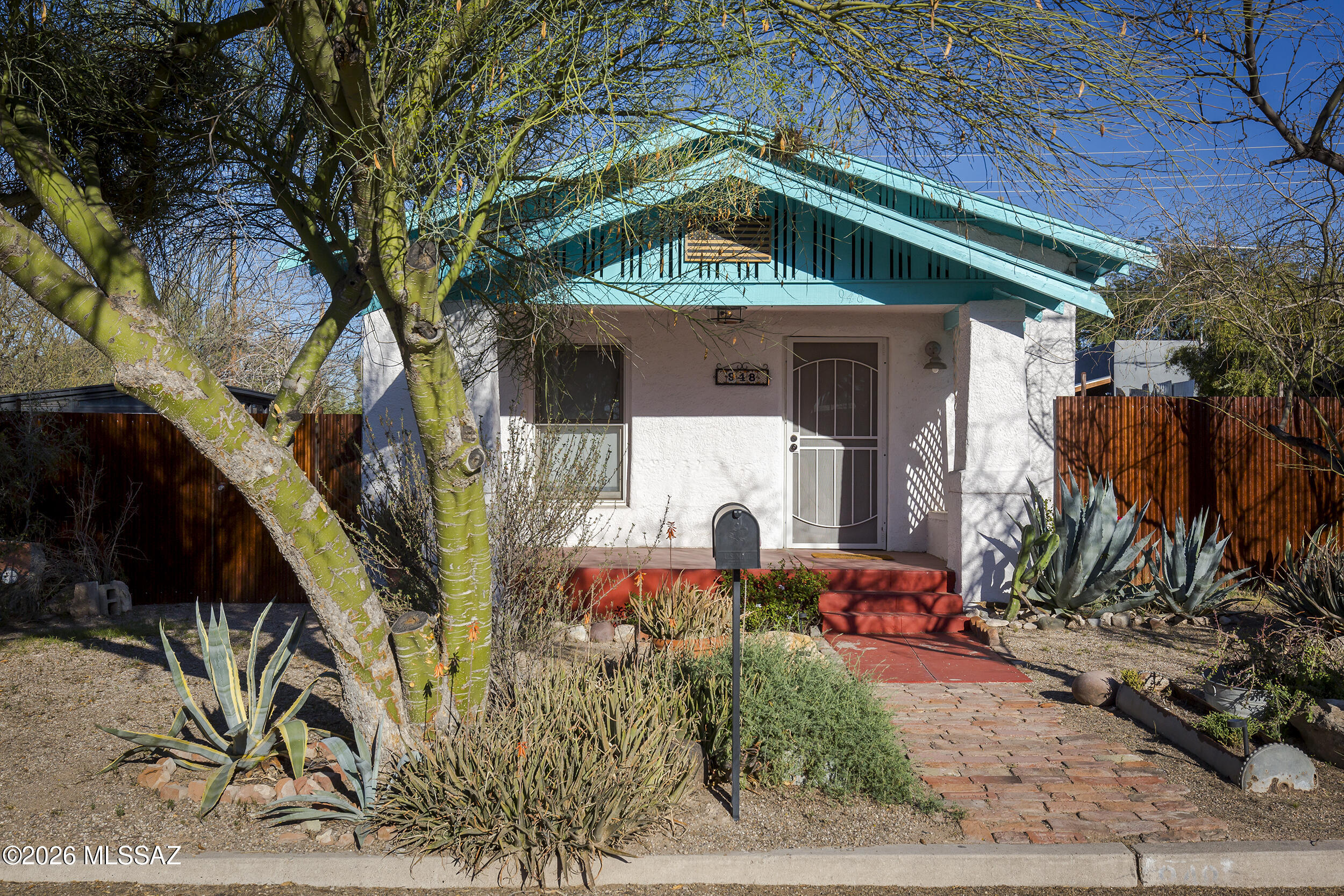 Oozing charm in this darling 1918 Dunbar Spring bungalow w/ guest quarters! This sweet front porch home is full of all the vintage charm you would expect in a desirable downtown neighborhood, but with all the most important upgrades done and ready for you to comfortably move in! Lovely original fir wood floors, high ceilings, saltillo and talavera tile in the kitchen with preserved original cabinets & new stainless appliances from 2022. Thoughtfully updated bathrooms. New energy efficient HVAC mini split system installed in 2022. Upgraded electrical to 200 amp service and new plumbing system. The back yard is its own private oasis that provides an outdoor shower, firepit, covered patio & storage. Perfect for Tucson backyard summer nights and winter desert bonfires. Continued.... Detached ADU structure. This universal space has AC & could be an art studio, office, gym, or small guest quarters. Bike score of 98! Close to restaurants, shopping, UA, Pima CC, downtown, parks, I10.