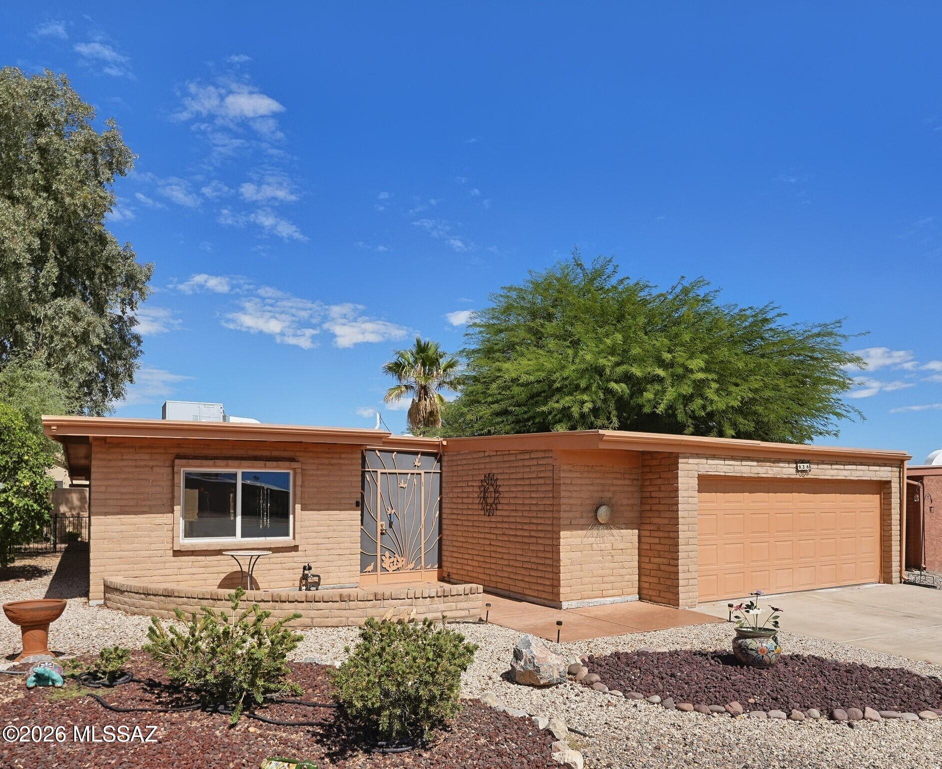 Move in ready 2-bedroom, 2-bath, 2-car garage, open concept floorplan, 1,032 sq ft (+208 sq ft not inc. in assessor) w/numerous improvements inc. security entrance & tile flooring throughout. Newer windows & sliders. Updated kitchen featuring an island, pantry, ample cabinets & quartz countertops + newer appliances. En suite bath has a walk-in tub & walk-in shower in Primary bedroom suite. + Beautiful walk-in shower in updated hall bath. Built-in Murphy bed in guestroom affords options when one doesn't have guests. Furnishings avail via SBOS, inventory avail. Slump block construction w/low care lot & bk patio situated on a quiet cul-de-sac w/Santa Rita Mtn views in The Villages + GVR amenities & active adult Green Valley lifestyle. Restaurants & shopping nearby. 20+ miles from Tucson.