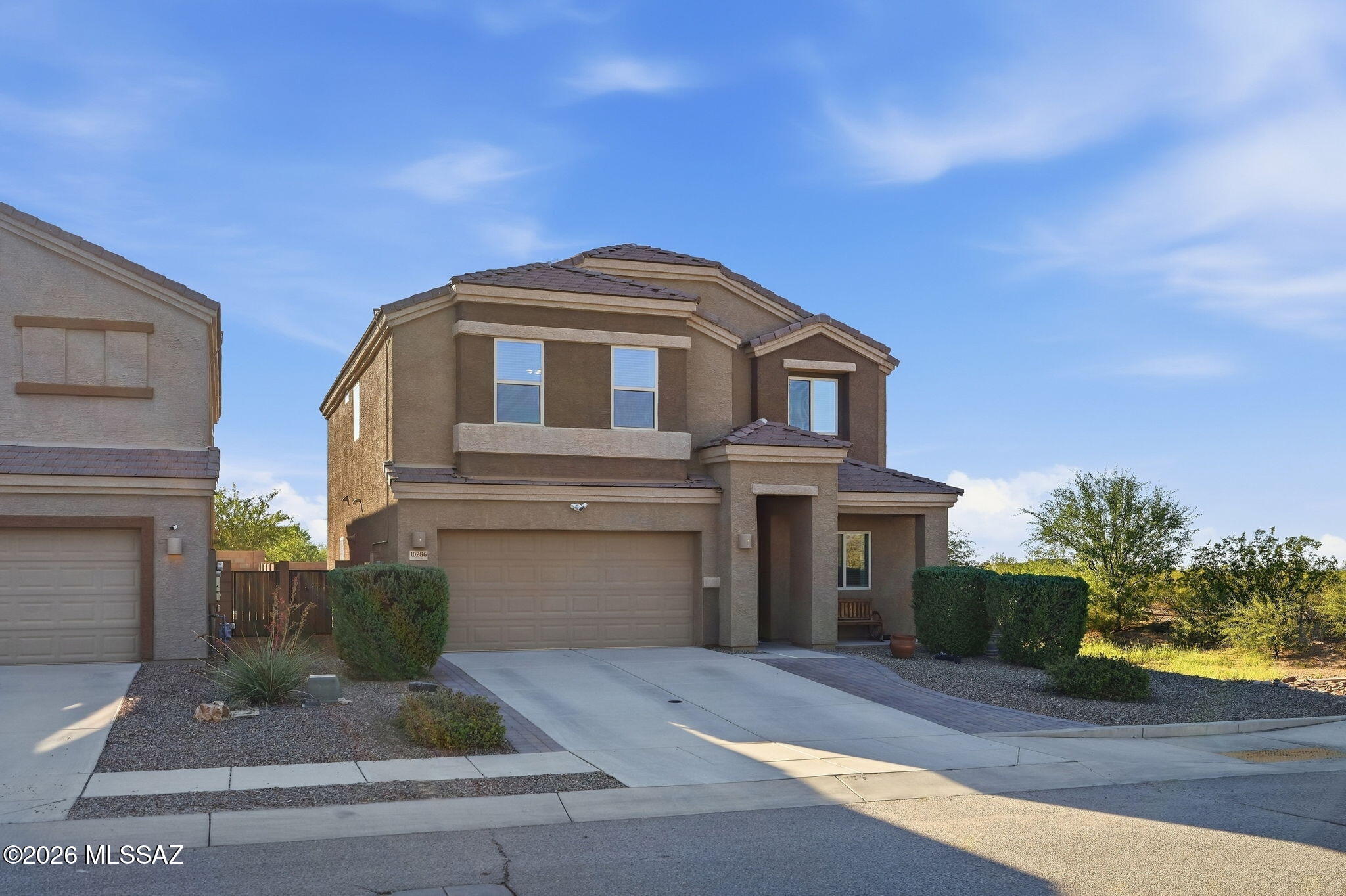 Assumable loan at 4.75%
Built in 2020 on a corner lot backing to state land, this Vista Del Lago Norte home in Vail delivers on the things that are hardest to find together: modern construction, a thoughtful floor plan with genuine flex space, outdoor living that works year round, and the No. 1 school district in Arizona. The main floor opens to a great room with beautiful ceramic plank tile floors in a wood finish, arched doorways, and a dining area with breakfast bar. A dedicated den off the main living area is sized for a home office, a formal sitting room, or a second family space. The kitchen is built around a gas range and center island, granite countertops, stainless steel appliances, a walk-in pantry, and a built-in microwave. Upstairs, find four bedrooms, a loft, and a dedicated laundry room. The primary suite includes a soaking tub, double vanity, separate shower, and walk-in closet. Ceramic plank tile continues through the wet areas and bedrooms are carpeted. Outside, a covered rear patio and brick paver courtyard open to artificial turf backed by open desert with no rear neighbors. Community park and walking trail within the neighborhood. Corner placement means more yard on two sides and only one shared property line. Also an owned Solar PV system, tankless water heater, water softener, smart panel, and alarm system included. The Vail Unified School District that is consistently rated No. 1 in Arizona and just minutes from great shopping and dining on the Houghton corridor. Colossal Cave Mountain Park nearby and Saguaro National Park East is a short drive away.
