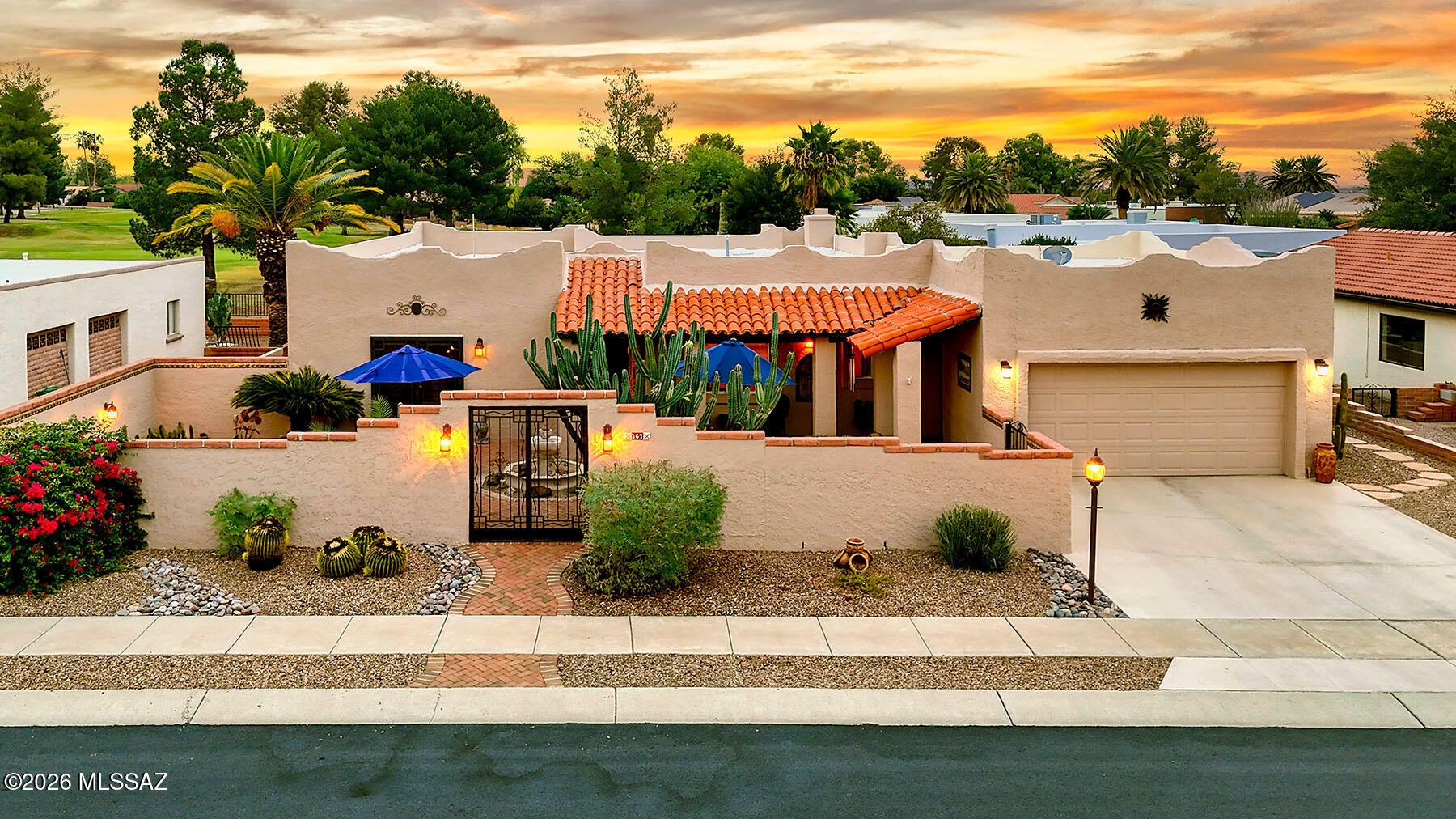 Timeless hacienda-style residence, where mountain vistas greet you at the front and fairway views unfold behind! Mature plantings and a softly cascading fountain frame the expansive front courtyard, creating exceptional curb appeal from the moment you arrive!
Begin your evenings with cocktails in the courtyard as the mountains glow at sunset, then move to the back patio for al fresco dining beneath the stars, with the golf course as your backdrop. A dedicated BBQ patio, conveniently positioned off the kitchen and dining area, makes grilling and entertaining effortless. Together, these outdoor spaces offer a variety of settings to gather, unwind, and savor the Arizona lifestyle.
Inside, warm ceramic tile flooring and rich, dark wood beams lend character and drama, anchored by a traditional beehive fireplace in the living room. A formal dining room is ideal for more elegant occasions, while the bright, spacious kitchen overlooks the courtyard and offers a sunny breakfast nook for more casual meals. Updated appliances, a center island, a built in buffet and a beverage refrigerator, make it as functional as it is beautiful. An Arizona room sits at the back of the home on the golf course, creating the perfect space for game night, craft room or movie room.  A smaller room is adjacent and works seamlessly as his and hers offices.  
Two ensuite bedrooms provide exceptional flexibility: a spacious and private primary retreat plus a second suite which is well suited to guests, extended family, an adult child, or a mother-in-law arrangement.
Enjoy the convenience of walking to the golf course, recreation centers, and the farmers market. Here, days are meant to be spent outdoors, and family visits become lasting memories.
More than just a home, this is the desert lifestyle you've been dreaming of!