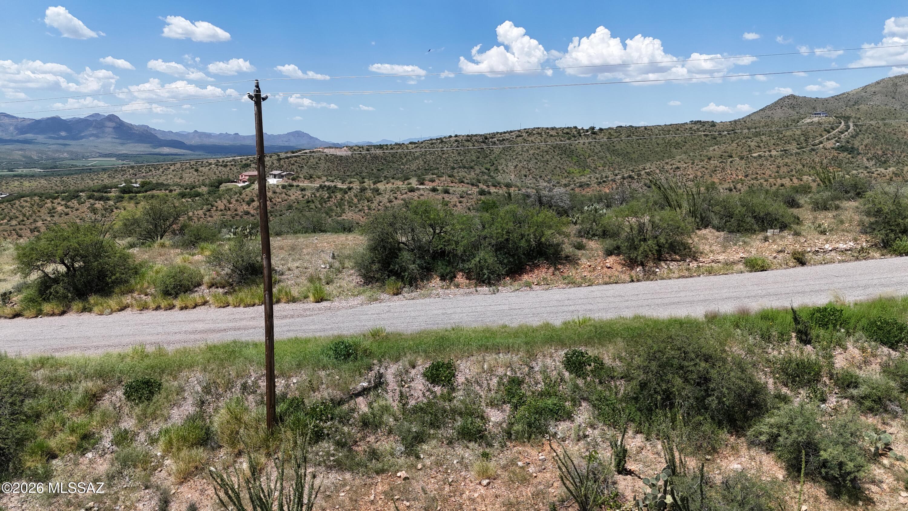 High view lot, all paved access.  Views of the entire Santa Cruz River Valley.