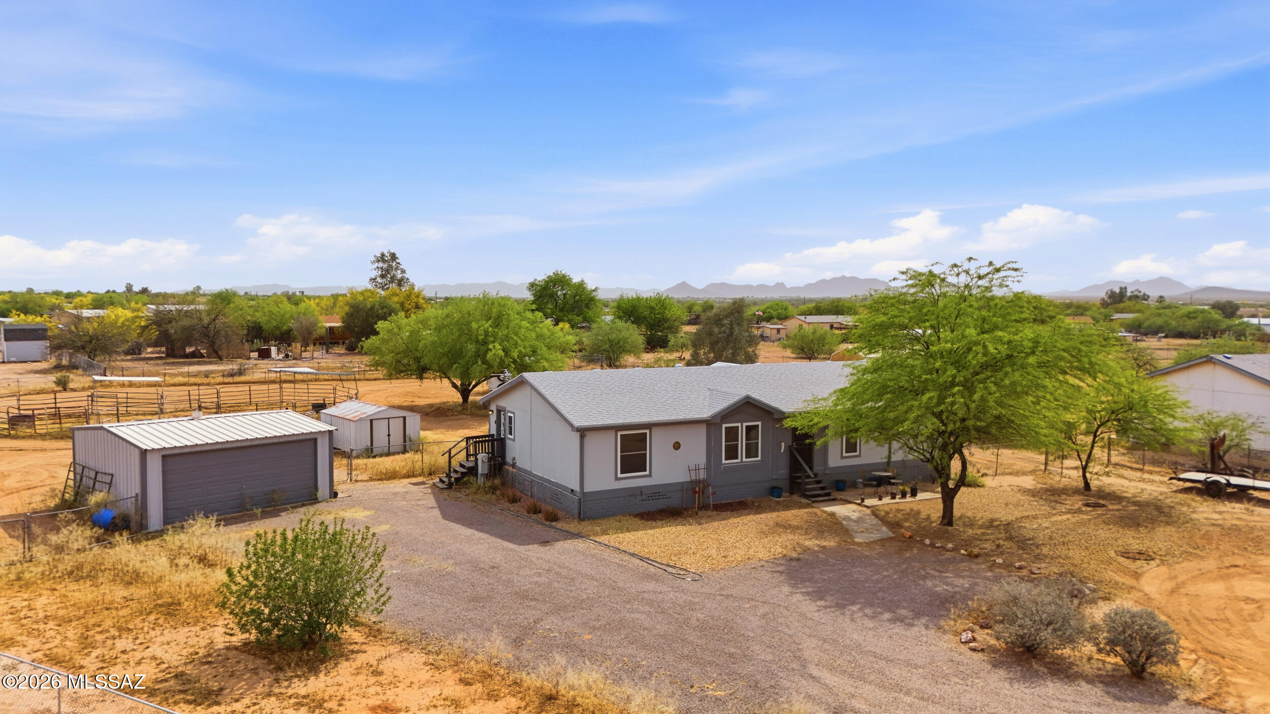 Range Priced ($257,000- $265,000) Bring your horses and your toys! Situated on 1.01 acres with all paved road access and water is serviced by GWR, no well or hauling required. This well maintained 4 bedroom, 2 bathroom home offers the space and functionality you've been looking for. Property features a corral, newer 12x10 barn/storage (2024), RV space and detached 2 car garage perfect for those needing room to spread out. Inside, enjoy updated luxury vinyl plank flooring throughout, dual pane windows, and a spacious layout designed for comfortable living. Major upgrades have already been completed, including a new roof (2021), HVAC system (2022), and full bathroom remodels with updated vanities, showers/tub, and fixtures. All appliances convey, making this home truly move-in ready. The home has been re-leveled (2021) and features improved ductwork and venting, plus a newer sliding glass door and exterior step upgrades, including a covered back porch, ideal for relaxing and enjoying Arizona sunsets. A rare combination of horse property, usable land, and modern updates with city conveniences. Don't miss this opportunity!