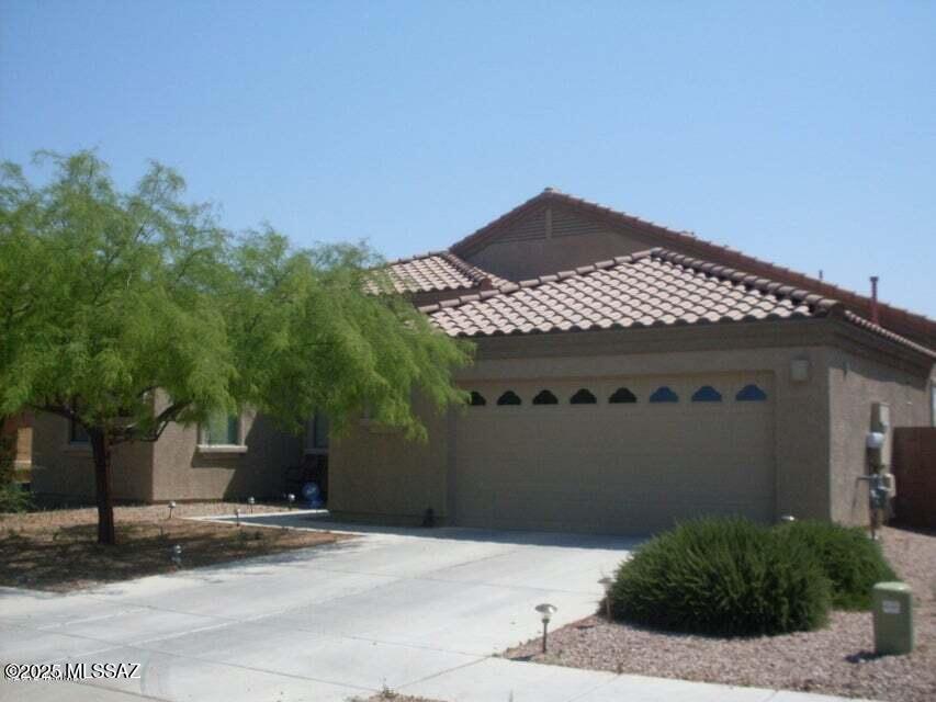 Fantastic home in a great neighborhood. This home is over 1900 sq feet with a huge great room and kitchen. The home has granite counter tops, 42 inch cherry cabinets, large 2 car garage, huge back yard with open space behind for privacy. Location is close to I-10, Davis Monthan, Raytheon and schools. Call agents for an easy appointment.