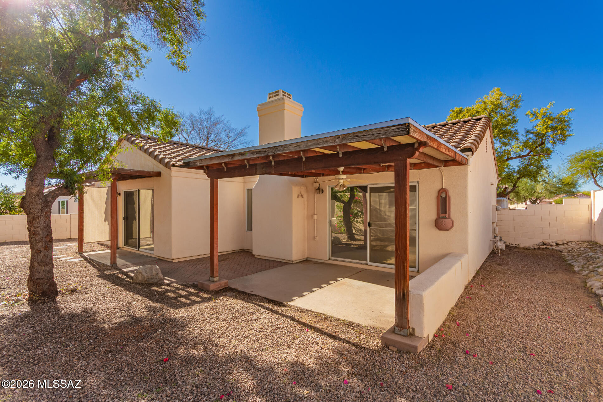 Move in ready home in Northwest Tucson! Located at 9880 N Western Sky Place in the North Ranch community, this single story 3 bedroom, 2 bath home sits on a quiet cul-de-sac and features a new tile roof, fresh interior paint, and new carpet. The open layout offers vaulted ceilings, natural light, and a gas fireplace in the main living area. The kitchen includes ample cabinetry and pantry storage. The primary suite provides patio access, walk-in closet, and dual sinks in the en suite bath. Enjoy Arizona outdoor living in the low-maintenance backyard with covered patio and shaded tree. Community amenities include a pool, tennis courts, volleyball court, and playground. Conveniently located near shopping, dining, parks, and outdoor recreation in highly desirable Northwest Tucson. Ideal for families, downsizers, or buyers seeking a turnkey home.