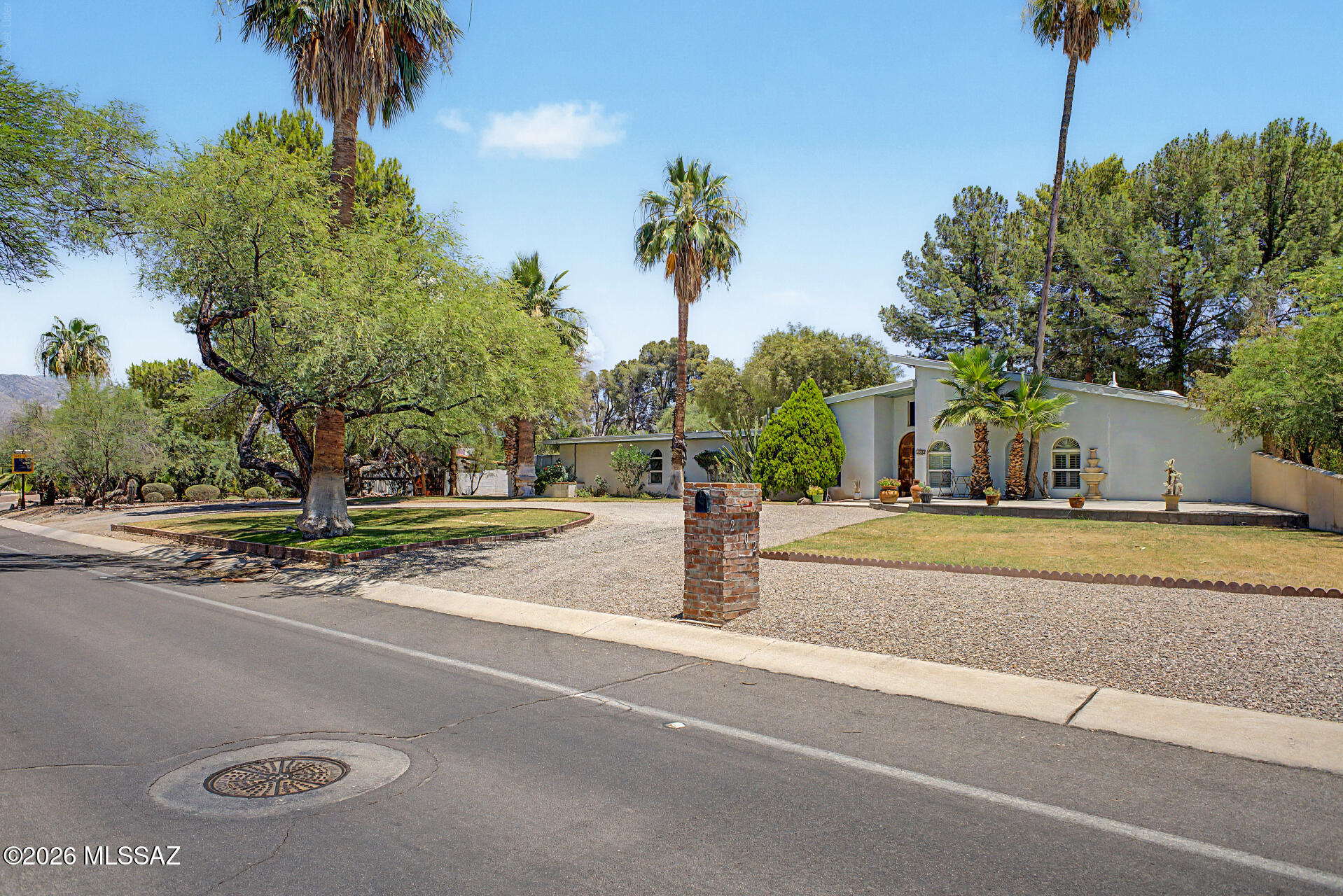 This 4-bedroom home sits on a stunning .70-acre lot surrounded by mature, beautiful trees in the desirable Tucson Country Club Estates area. The split floor plan offers a private master suite featuring wood floors and a large bathroom with both a bathtub and a separate shower. This home offers space, character, and endless potential.
Step inside to find a formal living room and a separate living room, both showcasing beautiful wood flooring throughout. The family room serves as a cozy gathering space, featuring a fireplace and a built-in entertainment center that offers both style and function.
The large kitchen boasts an open concept design, perfect for entertaining and everyday living. A versatile bonus room adds flexible space to suit your needs. Parking is a breeze with the impressiv 3-car carport.
Set on a generous, tree-shaded lot, this property combines comfort, character, and room to grow. Come see it today!

Chandelier located in the dining room will not convey.