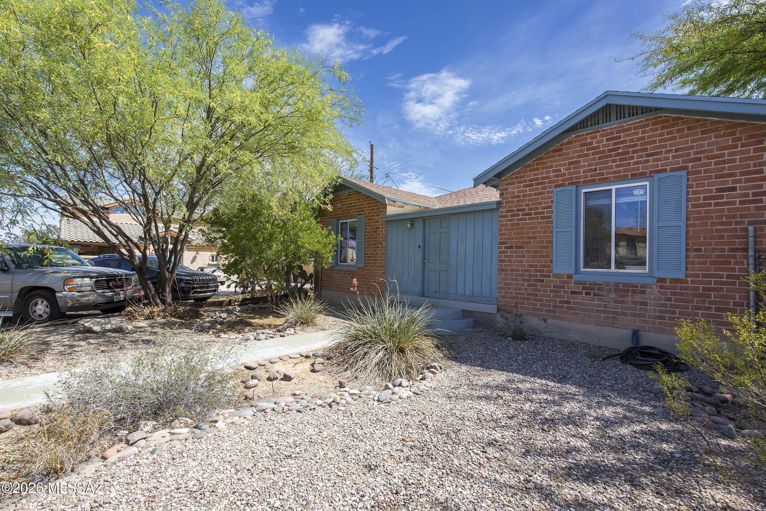 This is a great investor property! Leased  through July 2027at $2950 per month with tenants paying all utilities. It's a solid 1,773 square foot red brick home featuring 4 bedrooms and 2 full bathrooms. The interior offers generous public space, including a nice kitchen (with newer dishwasher and refrigerator) that opens to the living room and a den that could easily host guests. All of the bedrooms have their own exterior doors. Additionally, the property includes an on-site laundry facility and has no HOA. The home has an excellent layout and is situated in an ideal University area, making it a great  opportunity for a rental investment. Outside, you will find plenty of off-street parking and a large back yard. Please call me for a showing appointment and do not disturb the tenants