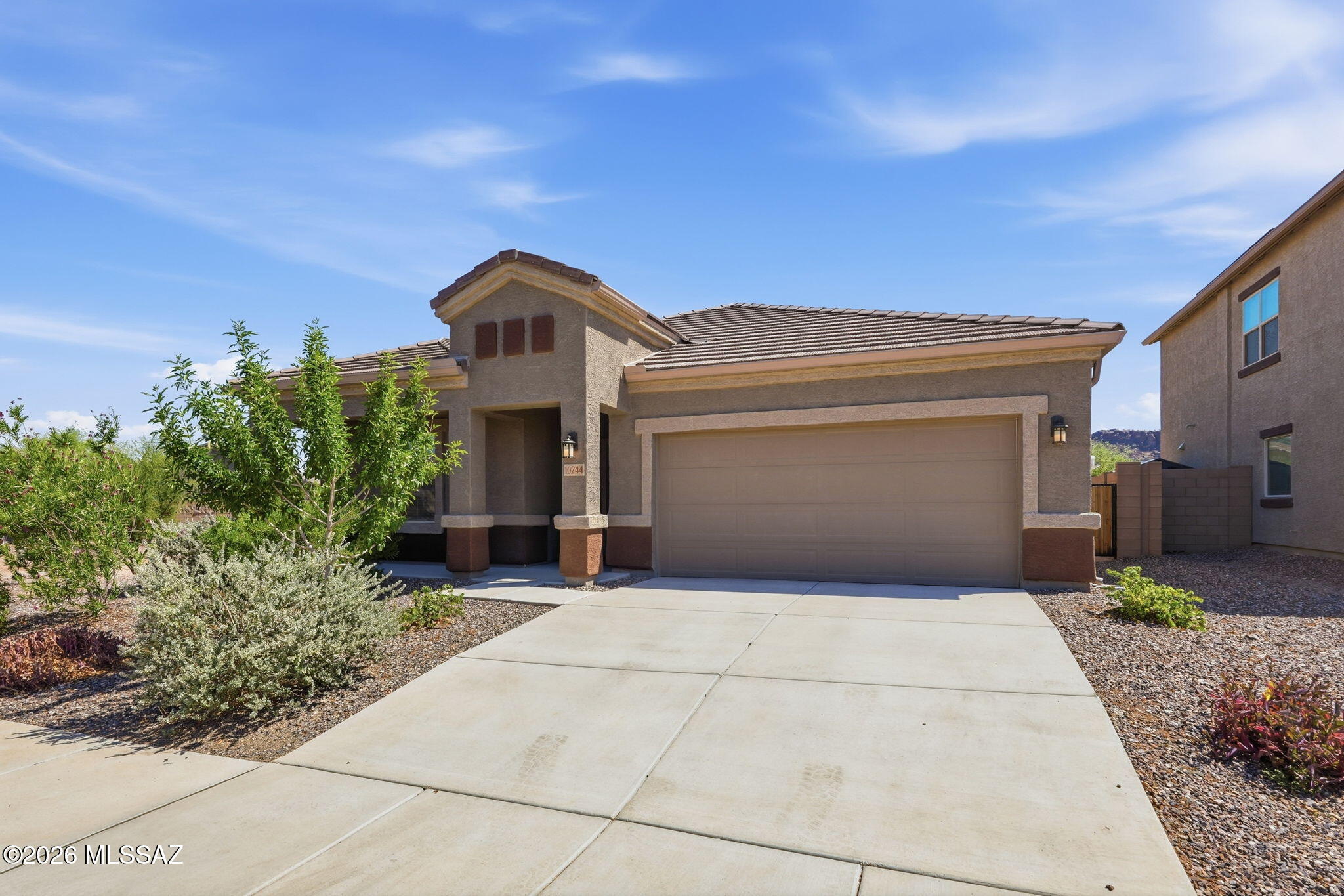 Seller shall counter and or entertain offers between $400,000 and $415,000.. Welcome to this beautiful 2024-built 4-bedroom, 2-bath home in the sought-after Saguaro Bloom community with convenient access to I-10. The open-concept floor plan seamlessly connects the kitchen, dining, and living areas, creating an ideal space for everyday living and entertaining. The kitchen features stainless steel appliances, a large center island, pantry, and modern cabinetry. The spacious primary suite offers dual sinks, a walk-in shower, linen storage, and a generous walk-in closet. Three additional bedrooms provide flexible space for guests, an office, or hobbies. The backyard is ready for your personal touch. Enjoy community amenities including a clubhouse, fitness center, pools, splash pad, parks, and walking trails.