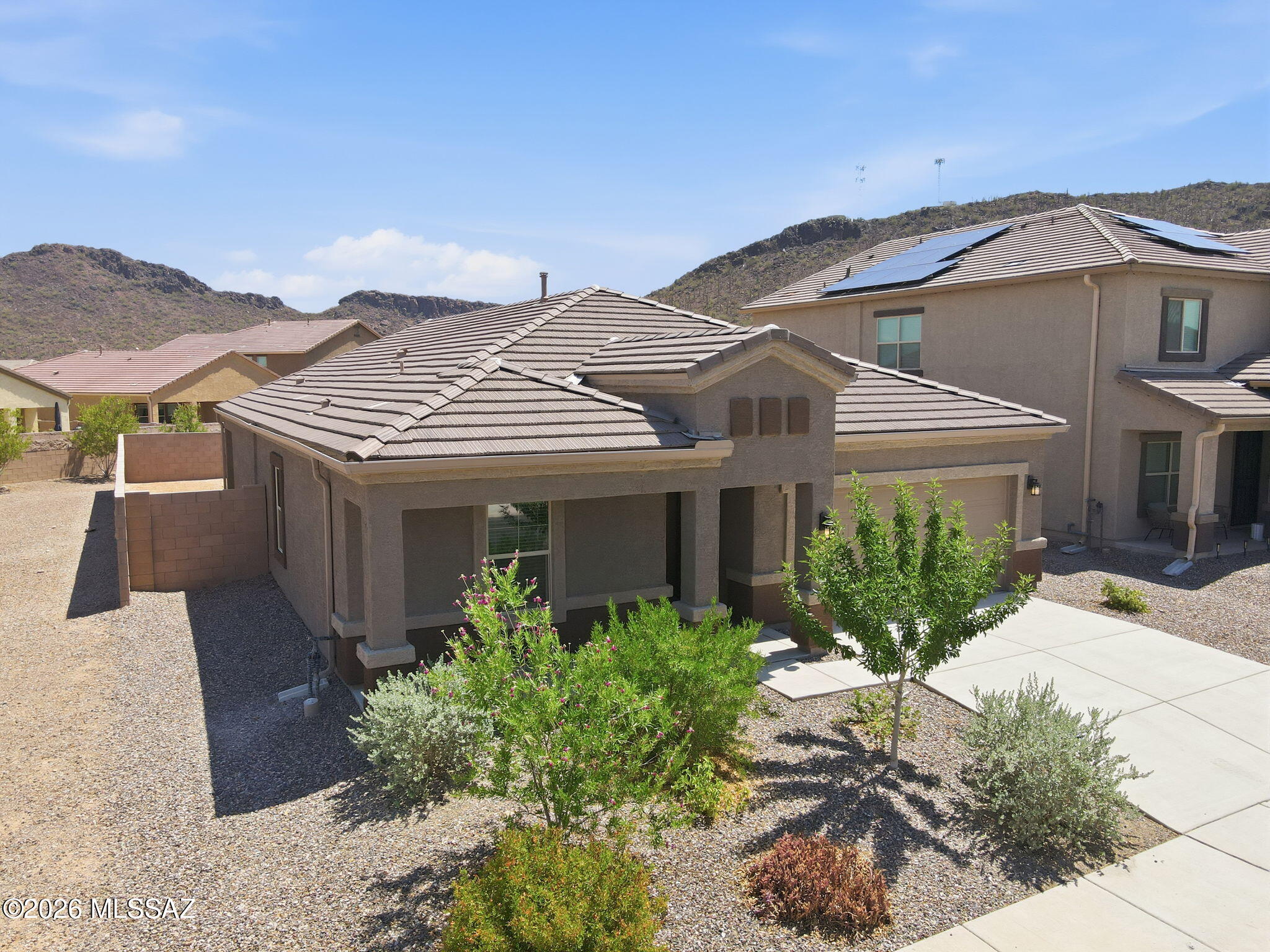Seller shall counter and or entertain offers between $400,000 and $415,000.. Welcome to this beautiful 2024-built 4-bedroom, 2-bath home in the sought-after Saguaro Bloom community with convenient access to I-10. The open-concept floor plan seamlessly connects the kitchen, dining, and living areas, creating an ideal space for everyday living and entertaining. The kitchen features stainless steel appliances, a large center island, pantry, and modern cabinetry. The spacious primary suite offers dual sinks, a walk-in shower, linen storage, and a generous walk-in closet. Three additional bedrooms provide flexible space for guests, an office, or hobbies. The backyard is ready for your personal touch. Enjoy community amenities including a clubhouse, fitness center, pools, splash pad, parks, and walking trails.