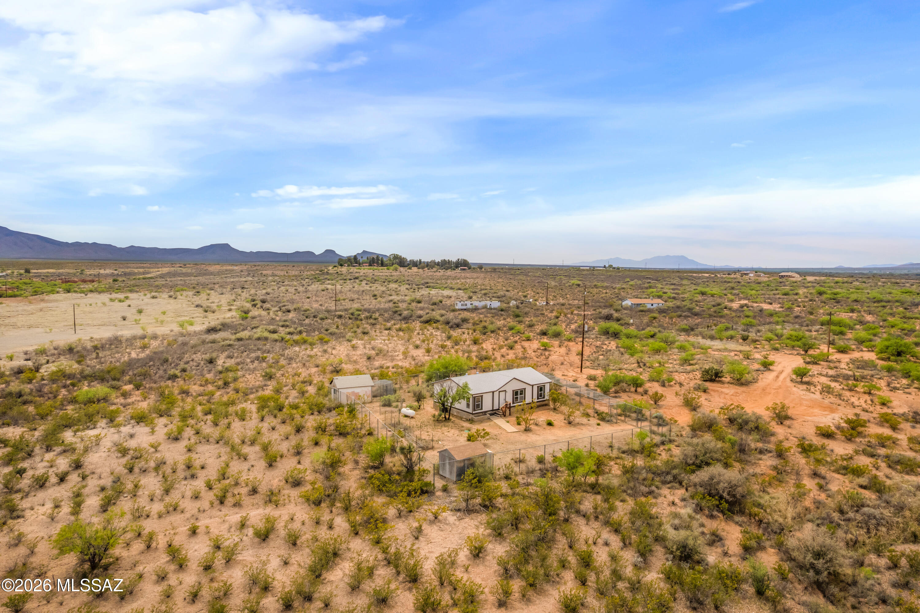 Horse property! This 3 bedroom 2 bathroom 1232 sqft manufactured home sits on 4.693 acres! Home feature a brand new roof, fresh paint inside and out, new kitchen cabinets and appliances, new vanitys in bathrooms, new flooring, including carpet. Home was also repiped with brand new peks pipes and has a new water heater! The home is secured with an 8' chainlink fence, and also has a long dog run built in as well. There are some sheds that can be used as chicken coops. Home is remote but not to remote, 10 min from stores. Enjoy quiet sunsets and sunrises. Owner/Agen