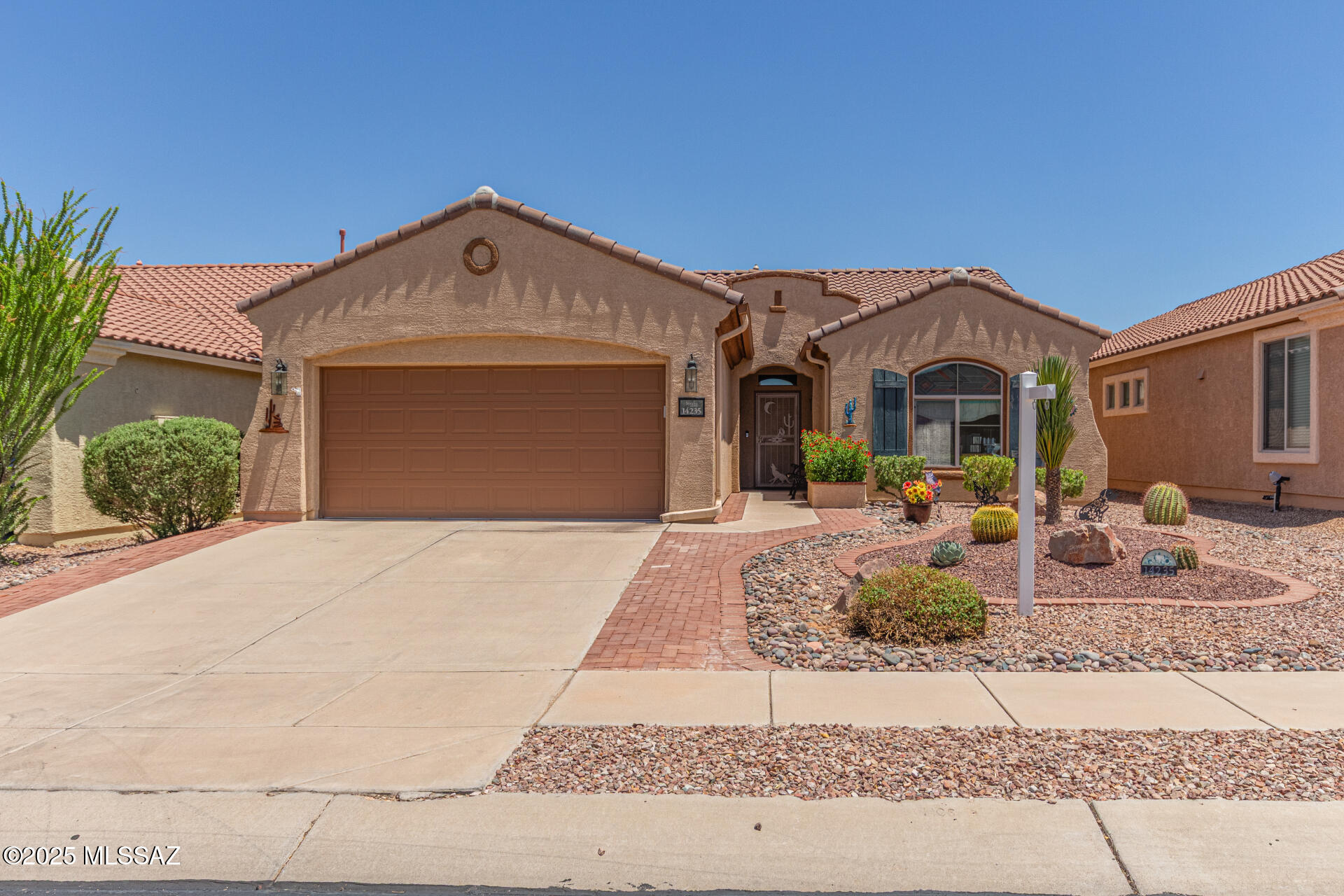 Become the proud owner of this lovely 3-bedroom residence in the much sought after adult Community of Sonora at Sahuarita Ranch! You're welcomed by a beautifully landscaped front & backyard w/ fruit & rose trees. Inside, you'll find a delightful open layout w/ high ceilings, a soothing palette, & attractive wood look tile flooring for a timeless appeal.  Gourmet kitchen comes w/ solid surface counters, wood cabinetry w/crown moldings, built-in upgraded appliances, & two-tier island w/ a breakfast bar. The primary bedroom includes an ensuite w/ double sinks & walk-in closet. 2nd bedroom w/  Murphy.  Unwind at the end of a long day in the charming backyard, which offers a soothing fountain, hot tub & desert views. Newer Roof! Reduced electrical w/ seller owned solar. Do not miss this