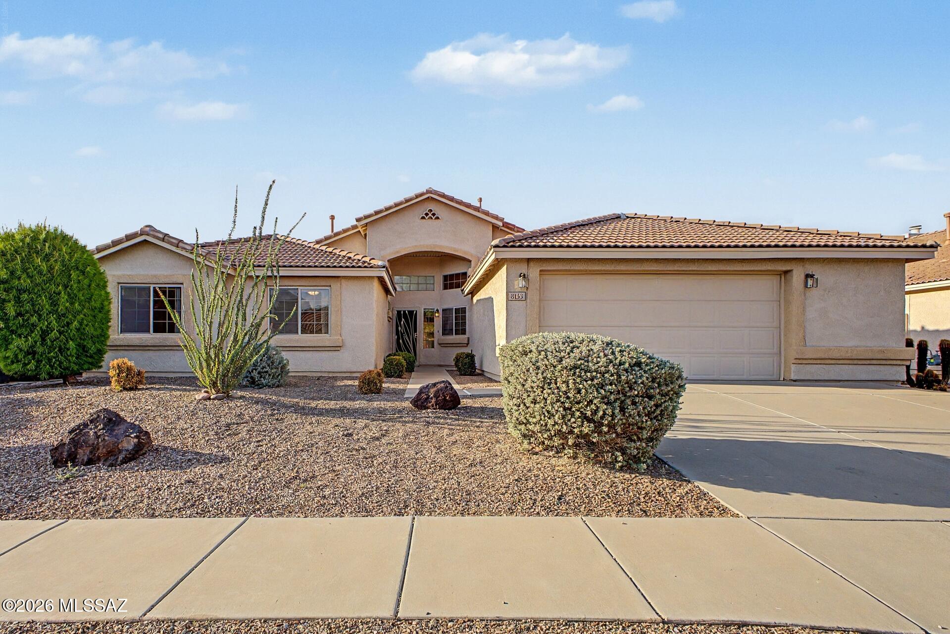 Gorgeous Southwestern Ranch style home w/ 4 bedrooms 2 baths & a 2-car garage is now on the market! Welcoming living/dining area features soft carpeting underfoot, tile in high-traffic areas, vaulted ceilings that enhance the space, neutral colors throughout & a fireplace w/ built-in seating & backyard access. The kitchen is complete w/ oak cabinets, a peninsula w/ breakfast bar, built-in pantry, & a breakfast nook. Stainless steel appliances includes electric range, OTR microwave, dishwasher, & refrigerator, are all existing as is. The primary bedroom offers a bay window & a private bathroom w/ double vanities, garden tub, & a walk-in shower. Fully fenced backyard features a covered patio, pavers, & a putting green, great for entertaining guests & family! Truly a must-see! Agent/Owner