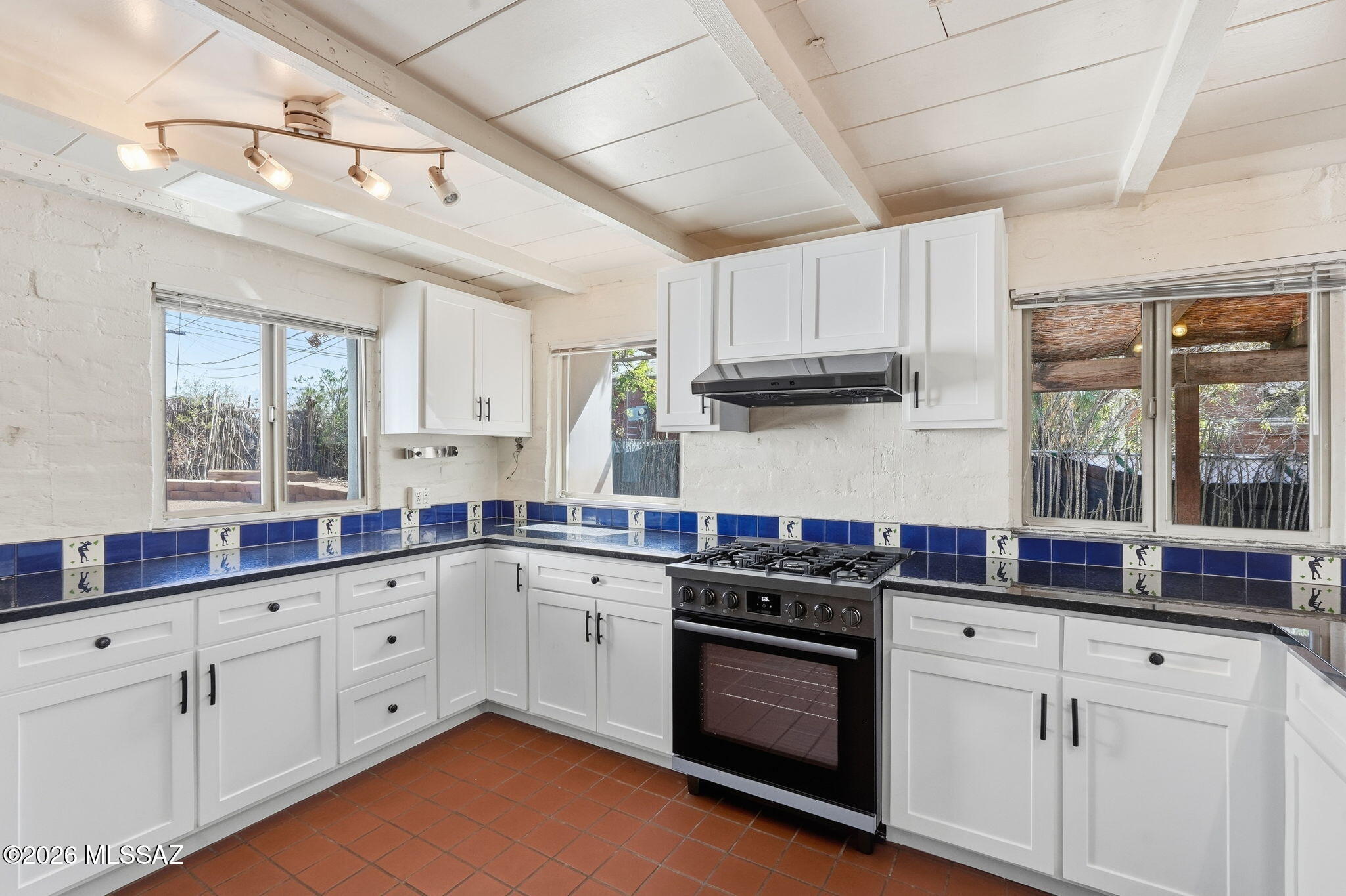 Walking distance to the University of Arizona! This unique 2-bedroom, 1-bath home showcases Southwest Heritage Ranch-style architecture with distinctive straw-bale construction, offering character and charm that is truly one-of-a-kind. Situated on a generous 8,233 sq ft lot, the property provides plenty of outdoor space while maintaining a convenient Central Tucson location. The HVAC was replaced in 2021, and the home features a solar water heater for added efficiency. Just a short walk from the University of Arizona and close to shopping, dining, entertainment, and everything Central Tucson has to offer, this distinctive home is a rare opportunity in a sought-after location.