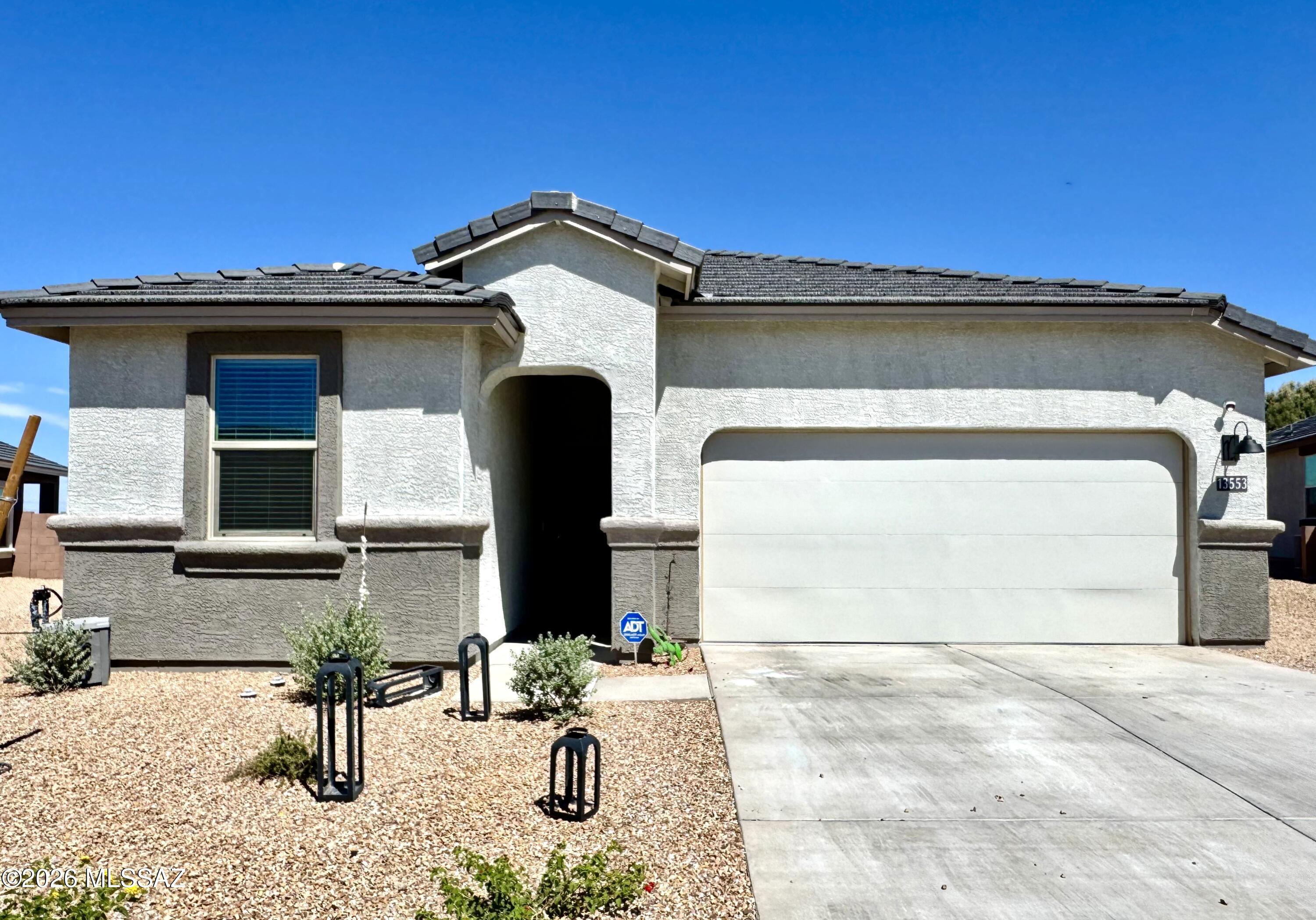 Welcome to this beautiful, nearly new 4-bedroom, 2-bath home in The Village at Barnett. Built in 2026, this spacious single-story home offers approximately 1,701 square feet with a thoughtfully designed split-bedroom floor plan and bright, open living spaces. The kitchen opens seamlessly to the great room and dining area, creating an inviting space for everyday living and entertaining. Features include a gas range, microwave, dishwasher, tankless water heater, energy-efficient windows and appliances, and a dedicated laundry room. The generously sized primary suite provides a comfortable retreat, while three additional bedrooms offer plenty of flexibility for guests, a home office, or additional living space. Outside, enjoy a covered patio, block-fenced backyard, and an attached 2-car garage. The Village at Barnett also offers neighborhood amenities including parks, sidewalks, and a basketball court. Conveniently located in Marana with easy access to shopping, dining, and schools.