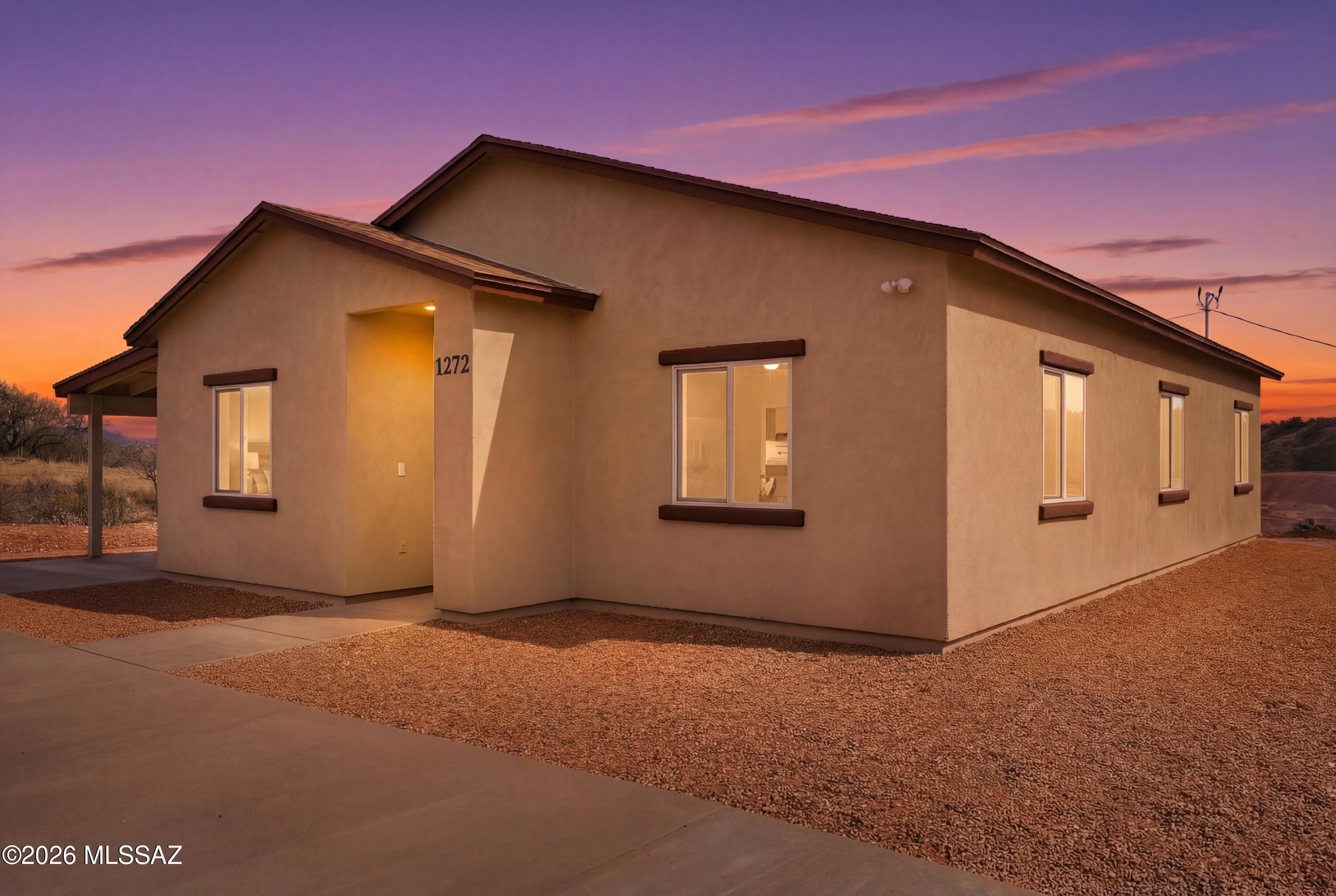 Brand new construction, USDA/0% down,  turn-key ready home ready to view! Come inside and walk this well laid out open floor plan including an open kitchen featuring new stainless-steel appliances and a neutral color palette. This home has 3 bedrooms, 2 bathrooms and no HOA and located off a paved road. All bedrooms have a very spacious feel with tile throughout, and they also all have ceiling fans already installed. Sweeping mountain views from every direction. Home is located right off I-19 making it a very easy commute to Tucson, Nogales and surrounding areas. Call me to schedule your showing today!