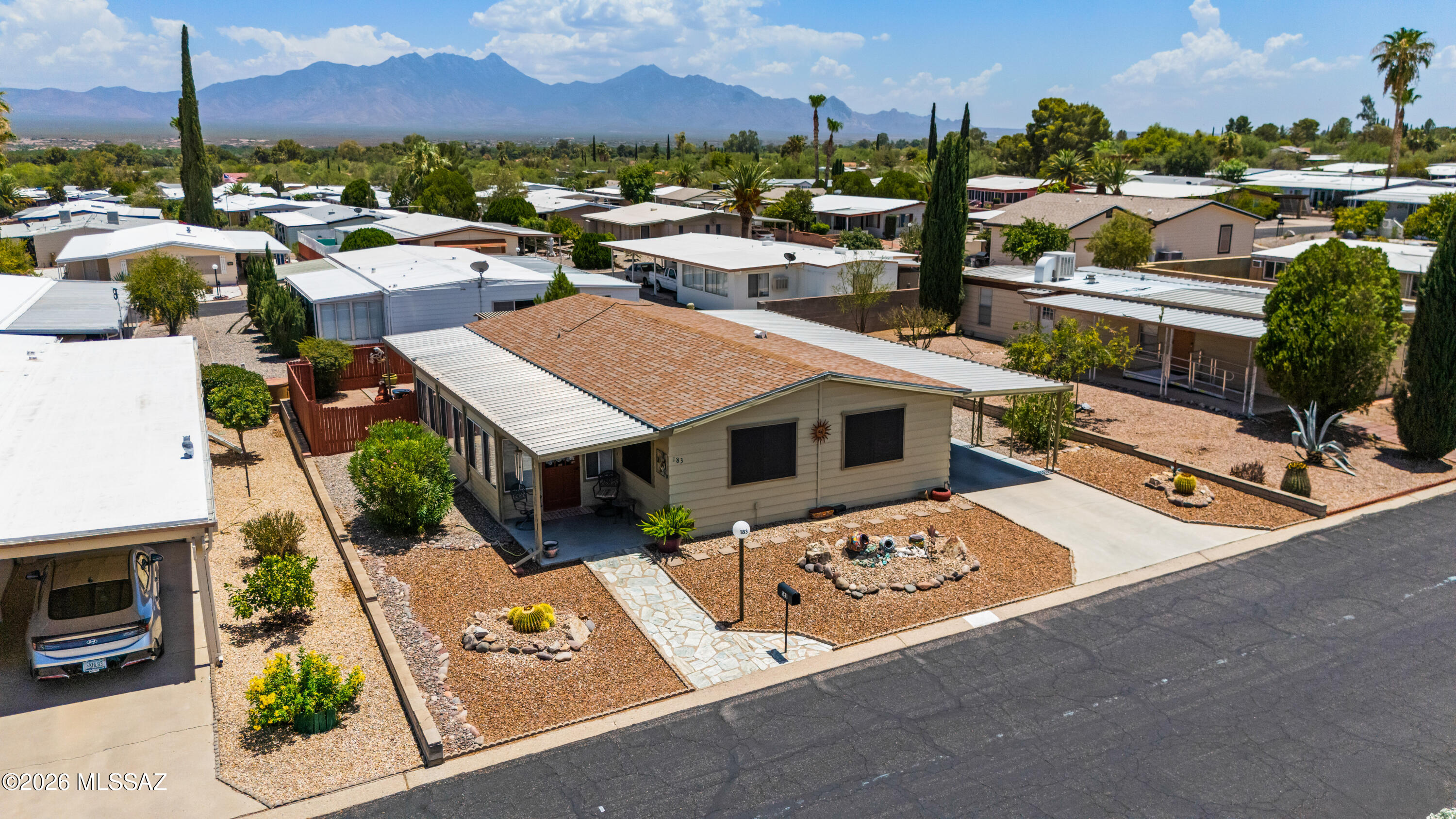 You will want to see this nicely upgraded and well maintained home that includes laminate floors and newer carpet in bedrooms. The kitchen has upgraded countertops, backsplash, and deluxe appliances. The master bath is set up with a walk in shower. The plumbing has been replaced with PEX piping. The roof was replaced five years ago. The glassed in Arizona Room, with a beautiful mountain view, is not included in the square footage and is cooled with portable evaporative system. The fenced in back yard features a patio for outdoor cooking and relaxation, a newer pergola and has mountain views. There is a large workshop/storage shed in the two vehicle carport.
The low HOA fees include a nearby clubhouse, swimming pool, and many activities. Rubbish removal is also included.