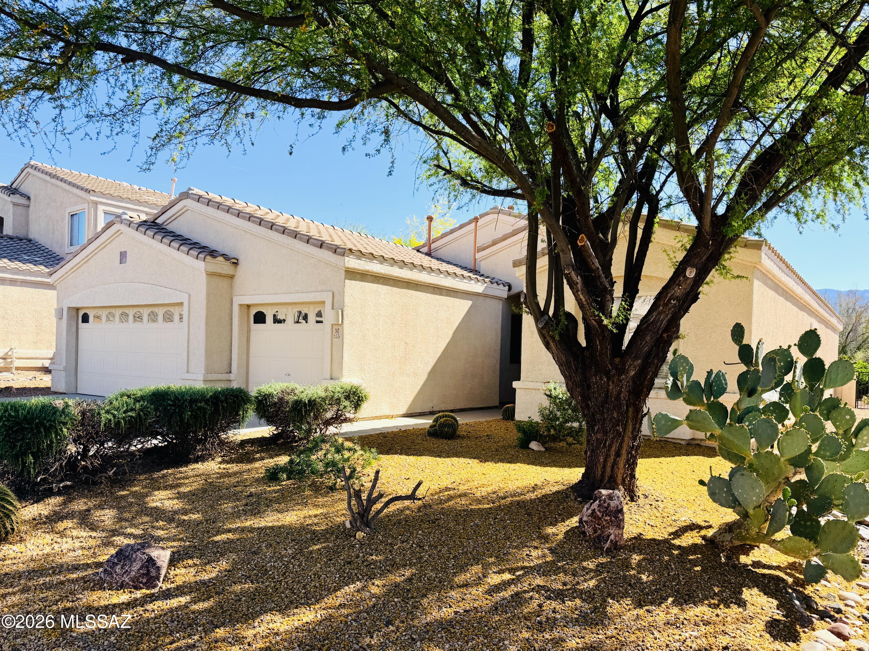 Refreshed and Updated!!  Featuring 4 Bedrooms, 2 Baths, Vaulted Ceilings, Split floor plan, with a 3 car garage. with Beautiful Mountain Views!  Fresh Interior paint, New carpet, Brand New Stainless steel appliances, Updated lighting/fixtures and a Refreshed landscaped backyard.  Second Refrigerator in Garage is a Bonus!  Major upgrades include a New Roof completed in 2023, New water heater in 2025, and a Newly dual-zoned Hvac.  Located in the Heart of Rancho Vistoso, where this neighborhood offers wide streets, lush community landscaping, parks, Trails, Golf, and Shopping.  Move In Ready!  Homes like this don't last!!  Come check it out!!  Washer and Dryer comes ''AS IS''