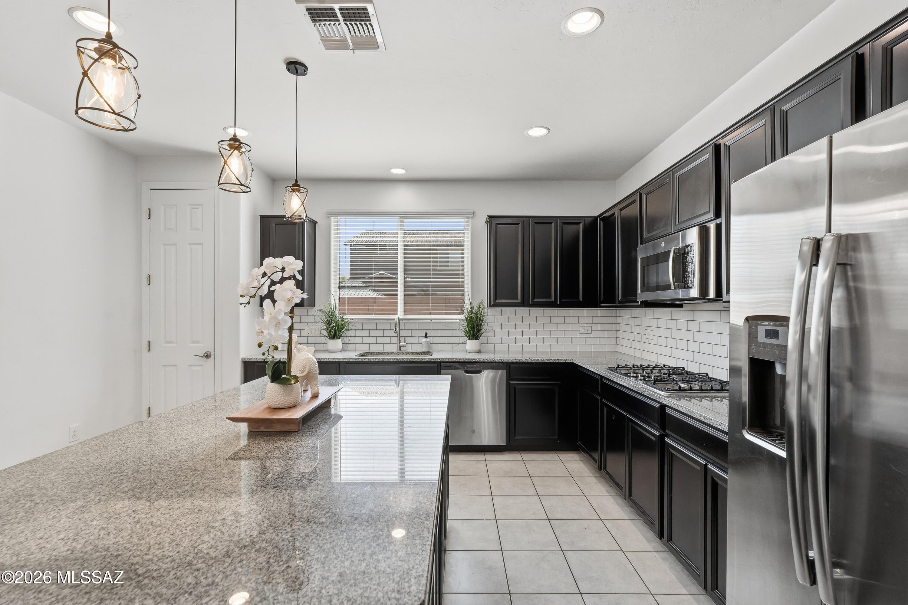 Located in one of Southern Arizona's most desirable master-planned communities, this two-story Rancho Sahuarita home features 4 bedrooms, a den, and a large loft, giving you plenty of room for work, play, and everyday living. The open-concept design centers around a spacious kitchen with a large island that's ideal for entertaining. Situated in Entrada La Villita, you'll enjoy access to Rancho Sahuarita's outstanding amenities, including community pools, a splash park, fitness facilities, walking trails, parks, sports courts, and the community lake. Shopping, dining, and schools are just minutes away! Welcome home!