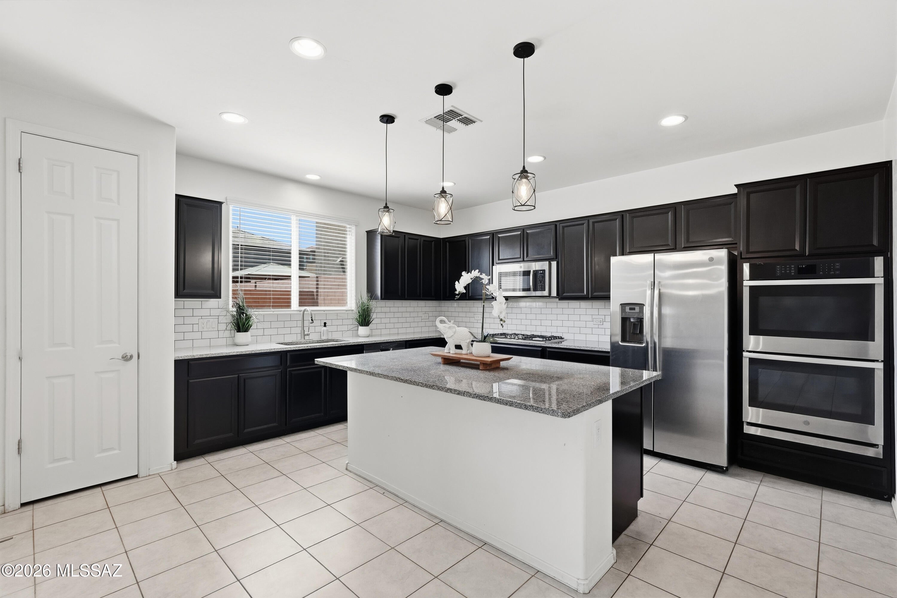 Located in one of Southern Arizona's most desirable master-planned communities, this two-story Rancho Sahuarita home features 4 bedrooms, a den, and a large loft, giving you plenty of room for work, play, and everyday living. The open-concept design centers around a spacious kitchen with a large island that's ideal for entertaining. Situated in Entrada La Villita, you'll enjoy access to Rancho Sahuarita's outstanding amenities, including community pools, a splash park, fitness facilities, walking trails, parks, sports courts, and the community lake. Shopping, dining, and schools are just minutes away! Welcome home!