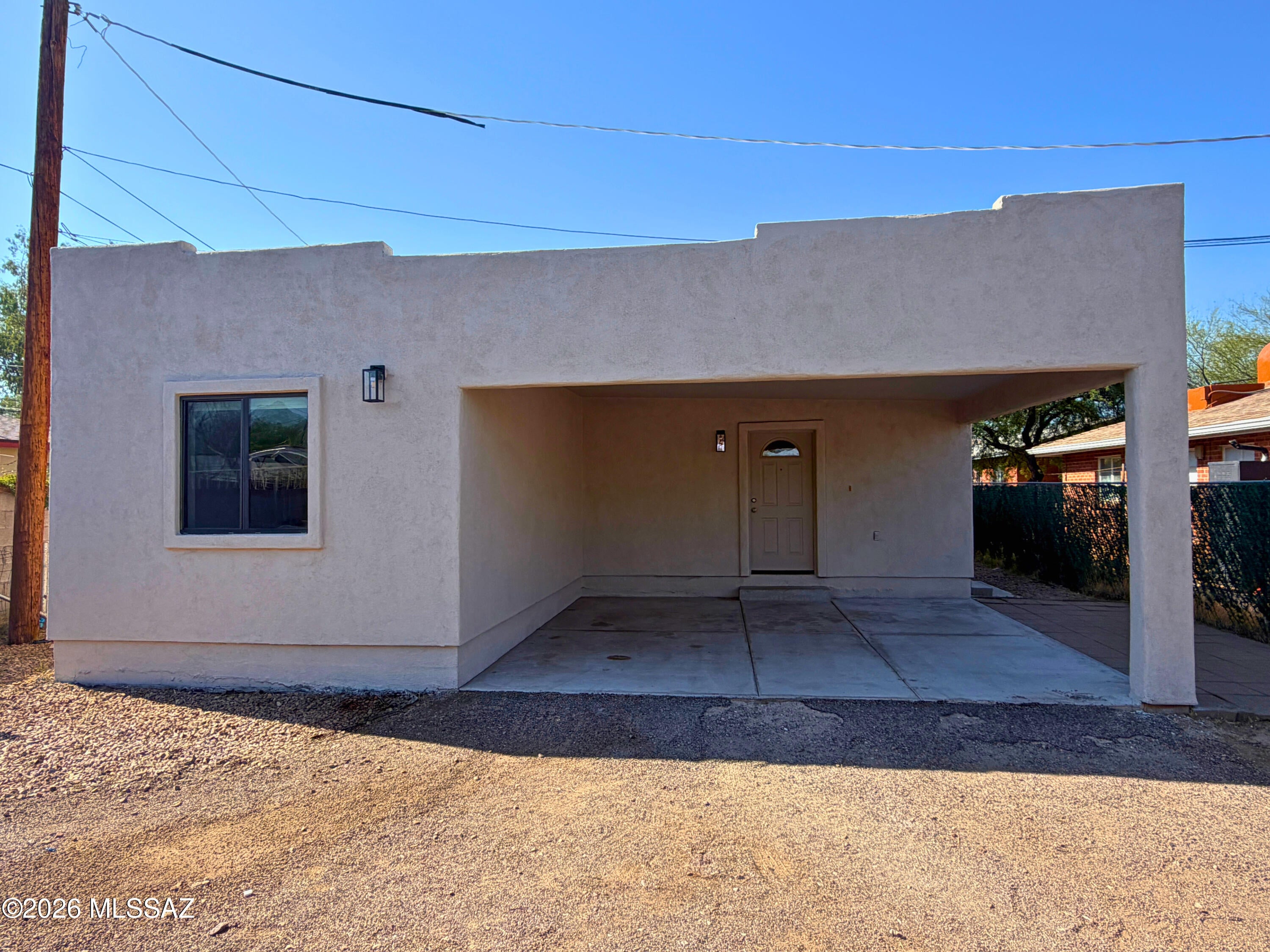 LOCATION! LOCATION! LOCATION! Ideally situated just minutes from the University of Arizona, this spacious 4-bedroom, 2-bathroom home offers 1,464 sq ft of comfortable living space and a functional, open floor plan. Freshly painted inside and out, the home has a clean, refreshed feel and is ready for its next owner. Polished concrete flooring runs throughout, complemented by large rooms, recessed lighting, and ceiling fans. Energy-efficient 2x6 construction and abundant insulation help provide year-round comfort. The recently recoated/painted roof adds additional peace of mind. Appliances stay, including a refridgerator, stove, dishwasher, built-in microwave, washer, and dryer are included.  Brand new water heater and brand new stove installed make this home move in ready.  Conveniently located near the University of Arizona, shopping, dining, and other amenities, this property is an excellent opportunity for a primary residence or investment property in a highly desirable Tucson location!