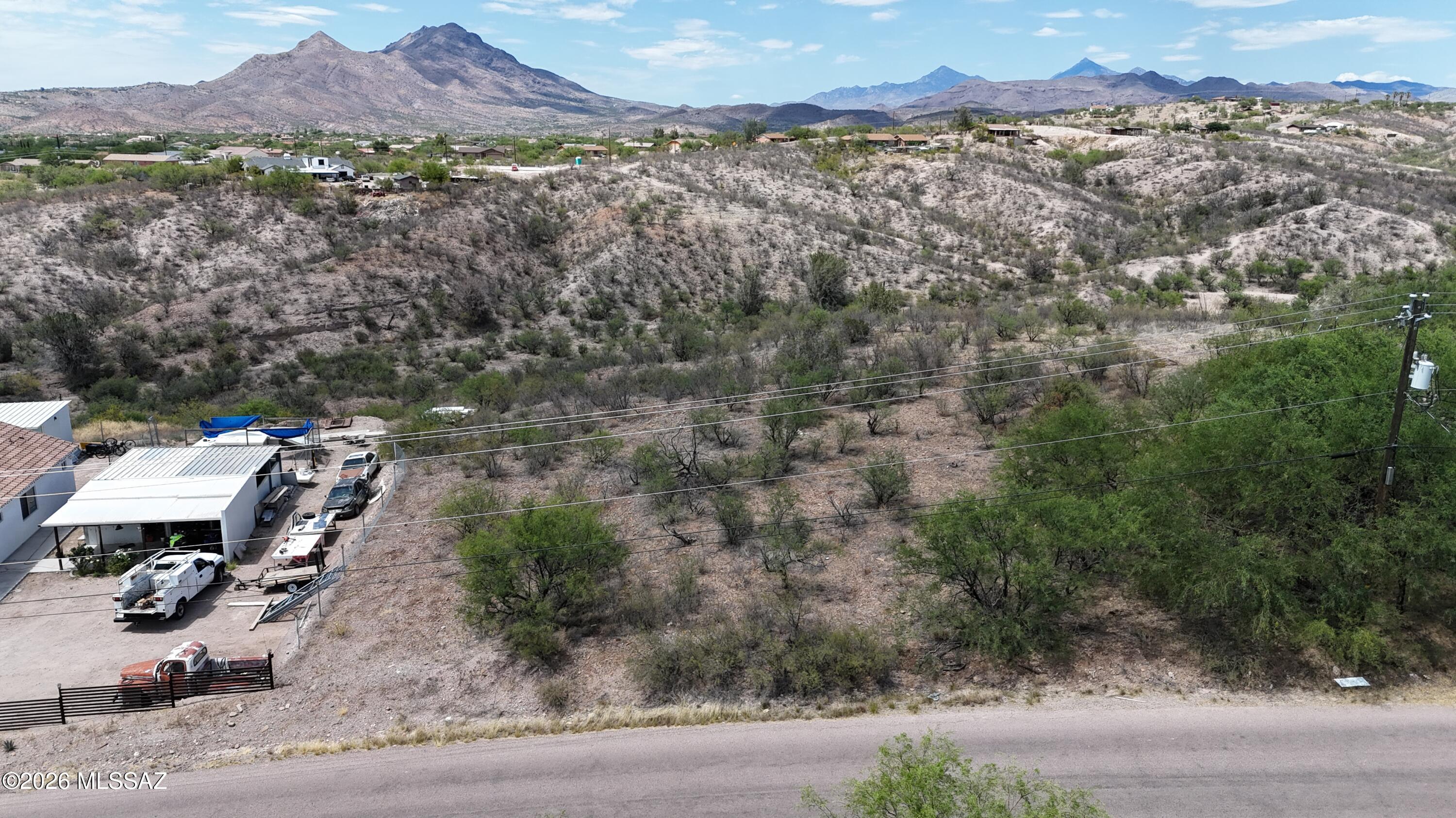 Residential building lot on the East side of Rio Rico between Paseo Mexico and Paseo Guebabi.  There are many homes built along this street so the water line should be in the street and power poles are there.  I will upload the water verification when I get it back from Liberty Utilities.  Will sell fast.