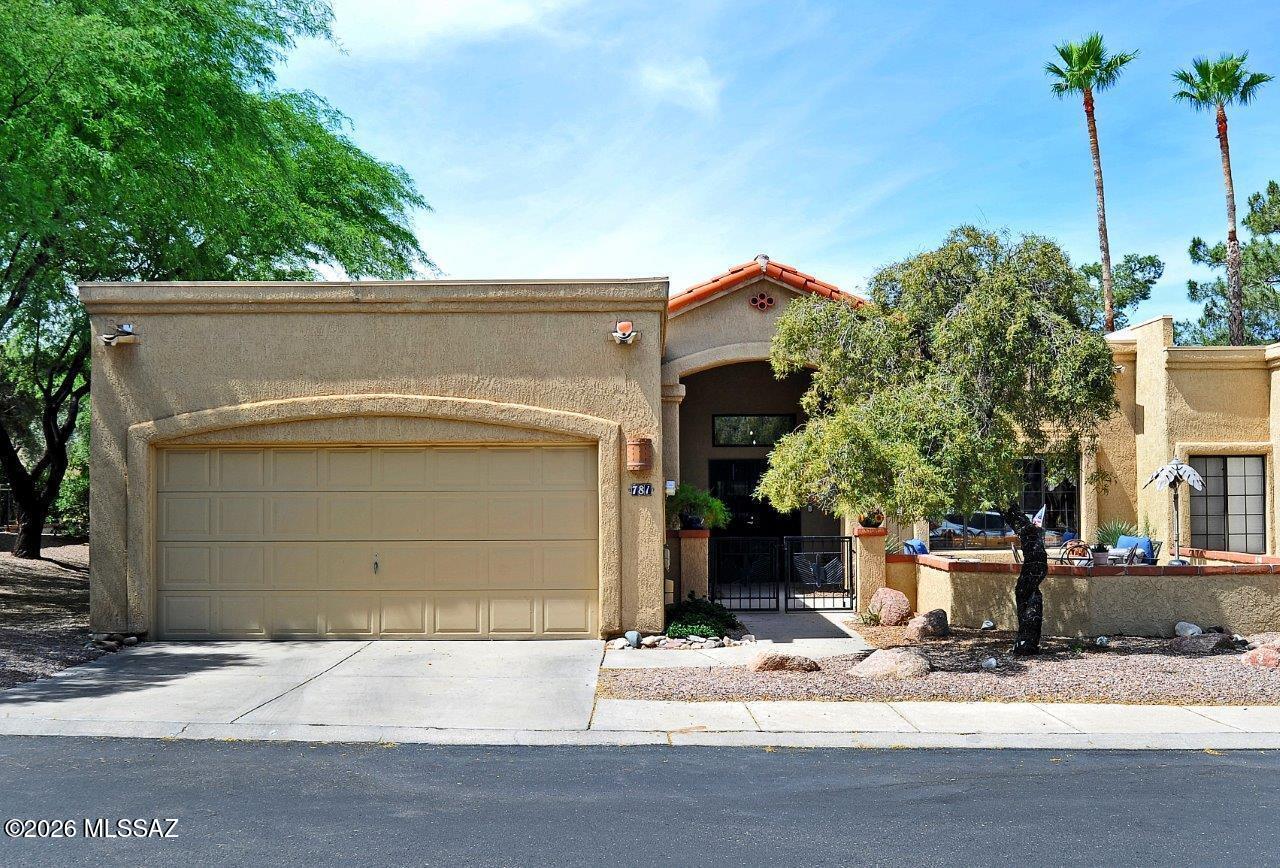 Oro Valley! Beautiful El Conquistator Resort 3BR/2BA patio home on 2nd tee of Pusch Ridge Golf Course. High ceiling with lots of light plus all tile with NO carpet. Upgraded kitchen has lots of space for indoor dining & prep. Cherry cabinets,quartz countertops & double oven. Living rm has high ceiling & cozy fireplace. Primary suite has huge new shower,double vanity & large walk-in closet. Double front door & security screen door. Lots of areas to enjoy include enclosed front courtyard with views of Pusch Ridge, recenlty added bonus room at back of home is a great space for entertaining overlooking the golf course.  Lots of storage & cabinets in 2 car garage. Water heater new & HVAC 4 years old.  No poly pipes replaced by a previous owner.   Don't miss this beautiful townhome!