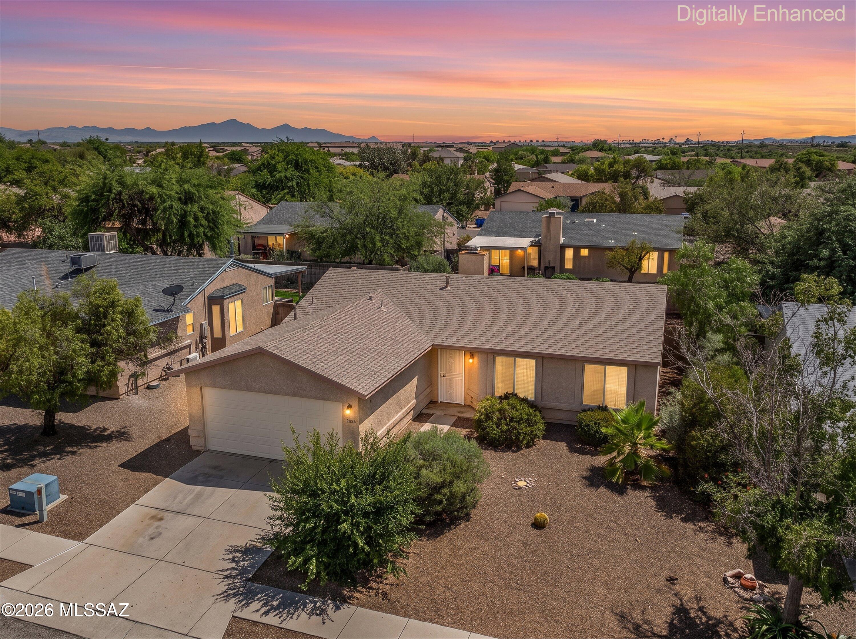 3BR/2BA home on a quiet cul-de-sac with Rincon Mountain views. Vaulted ceilings and a fireplace highlight the great room, while tile plank flooring runs throughout the home. The spacious kitchen features new stainless-steel appliances, abundant cabinet space, and a center island. Located in an established Eastside neighborhood near hiking and biking trails, Davis-Monthan Air Force Base, Pima Community College, Fred Enke Golf Course, and a variety of shopping and dining options.