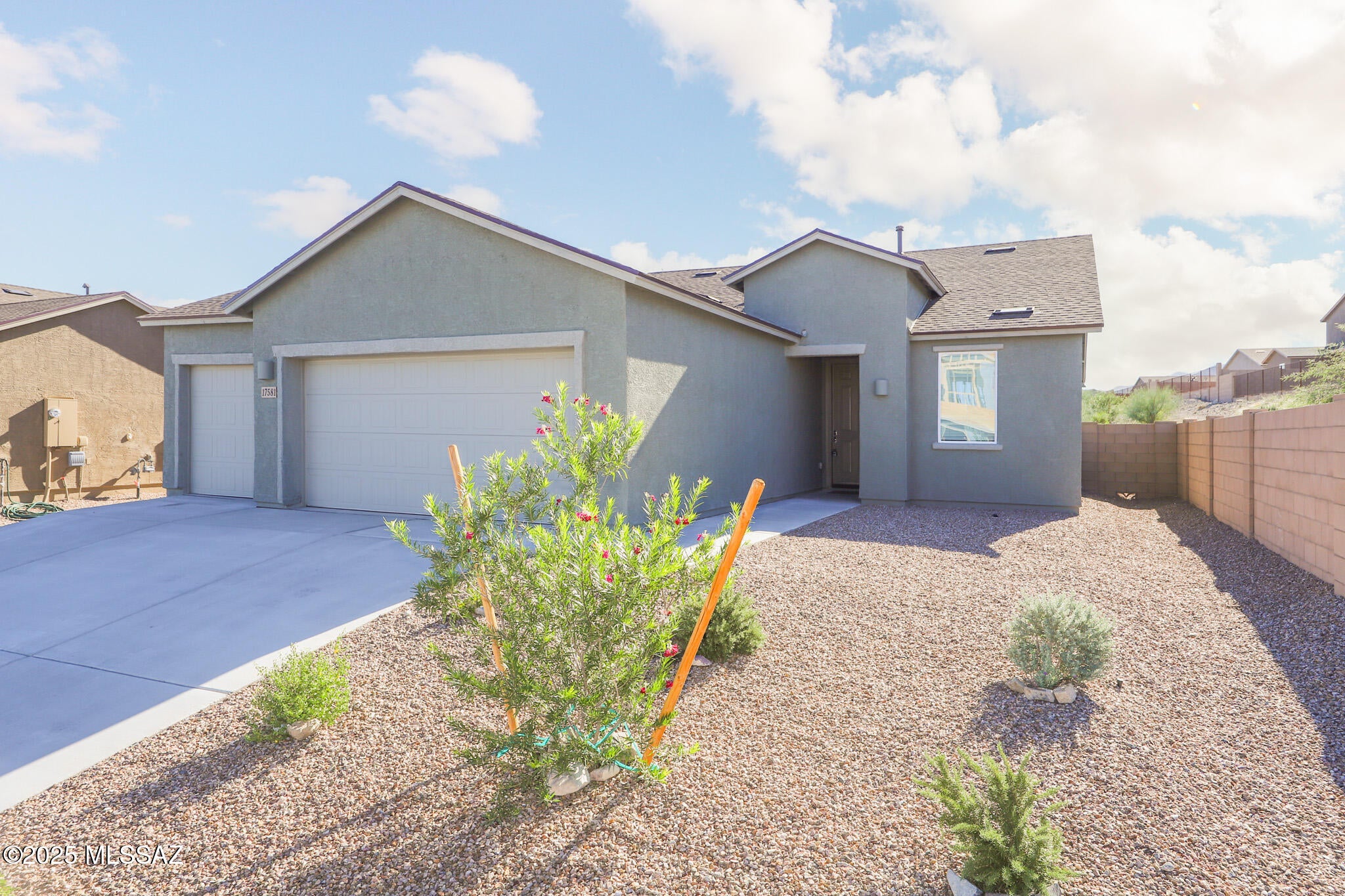 Welcome to this stunning new build in the sought-after Vail School District! This 3 bed, 2 bath home features a spacious great room with tile floors, perfect for entertaining. The modern kitchen offers stainless steel appliances, granite countertops, a large closet pantry, and a dedicated dining area. The primary suite includes a dual vanity and walk-in shower for added comfort. Enjoy convenience with a full laundry room complete with washer and dryer. The 3-car garage provides ample storage. Outside, relax on the covered patio overlooking a large backyard that backs to the desert with breathtaking mountain views. Community amenities include a park, pool, and scenic walking trails--perfect for an active lifestyle.